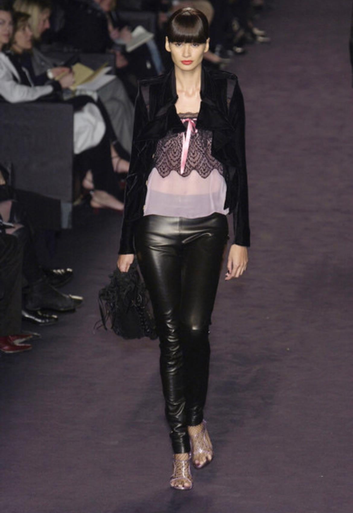 Presenting a fabulous pink and black lace Yves Saint Laurent Rive Gauche tank top, designed by Tom Ford. From the Fall/Winter 2003 collection, this top debuted on the season's runway as part of look 18. Constructed with sheer light pink chiffon this