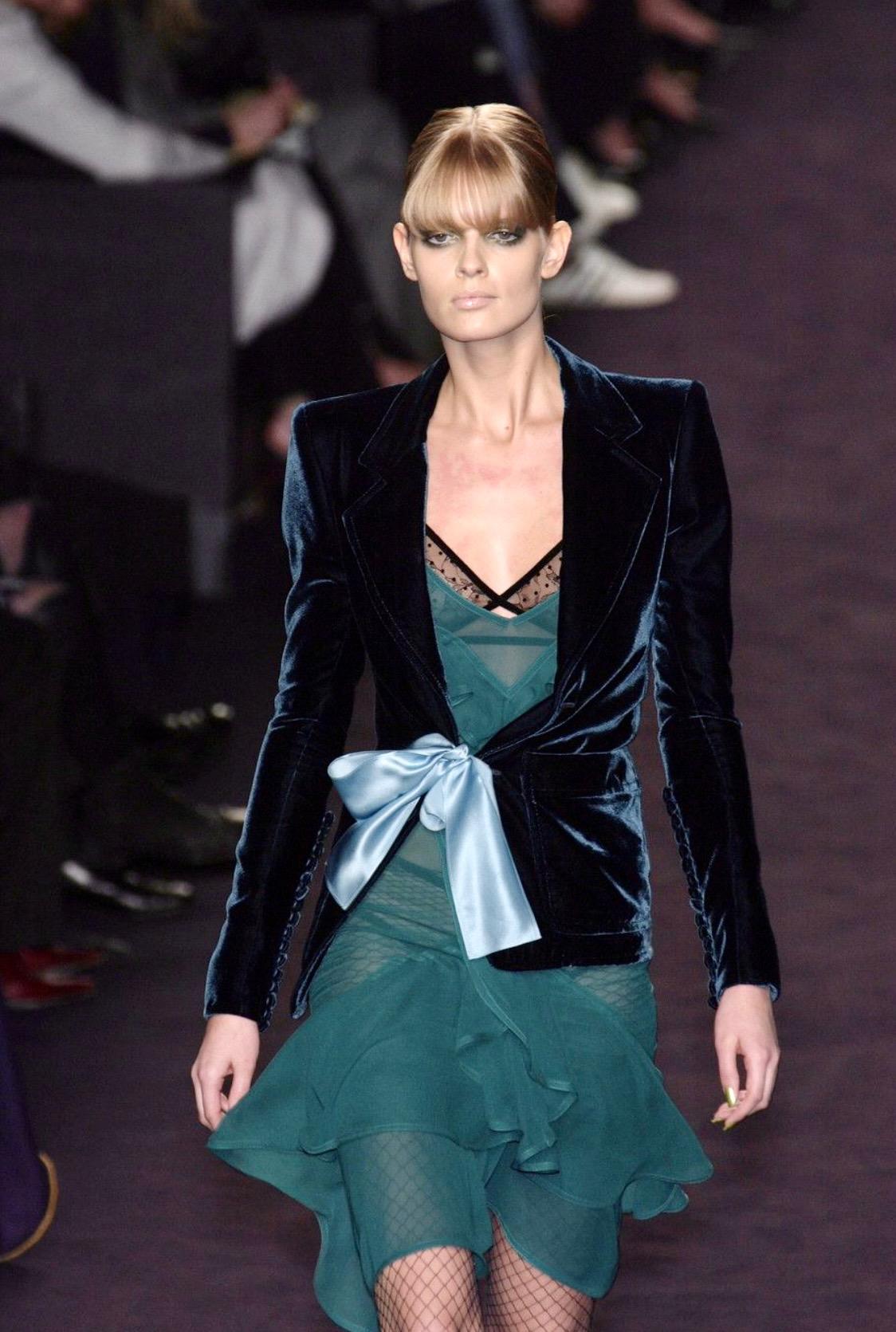 Presenting a deep green velvet skirt suit designed by Tom Ford for Yves Saint Laurent Rive Gauche's Fall/Winter 2003 collection. The blazer jacket debuted on look number 1 on Julia Stegner. Worn by Demi Moore to the premiere of Charlie's Angels: