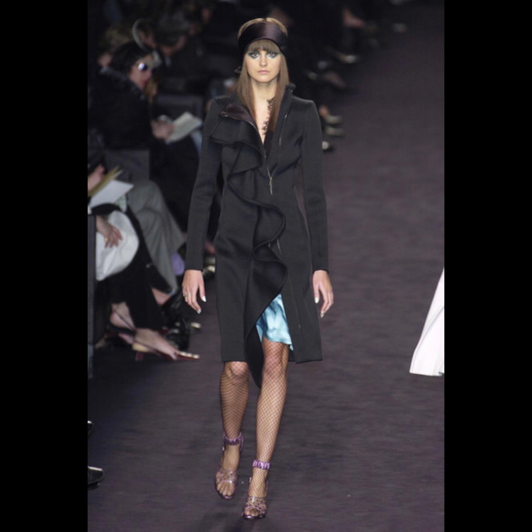 Presenting an elevated black Yves Saint Laurent Rive Gauche ruffle jacket, designed by Tom Ford. From the Fall/Winter 2003 collection, this jacket debuted on the season's runway as look 12. This coat features an abundance of fabric, covering the