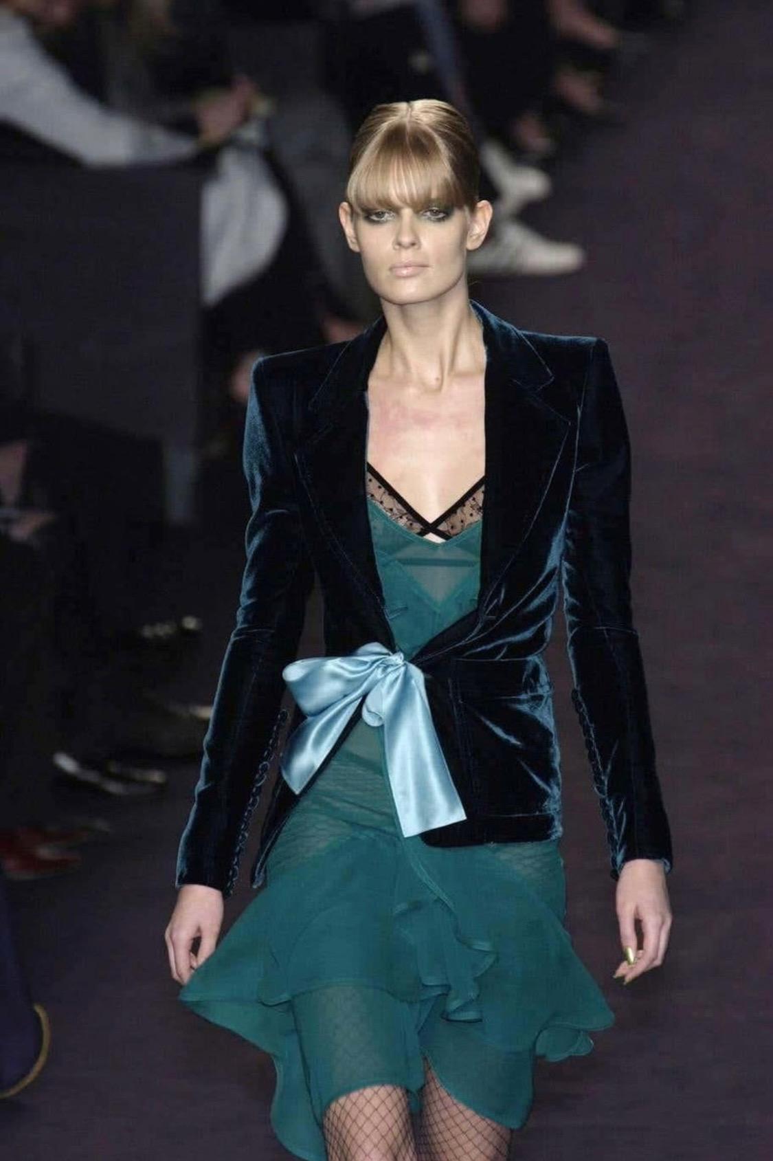 Presenting an iconic teal green Yves Saint Laurent Rive Gauche viscose tank top, designed by Tom Ford. From the Fall/Winter 2003 collection, a dress version of this top debuted on the season's runway as look 1 modeled by Julia Stegner and in the