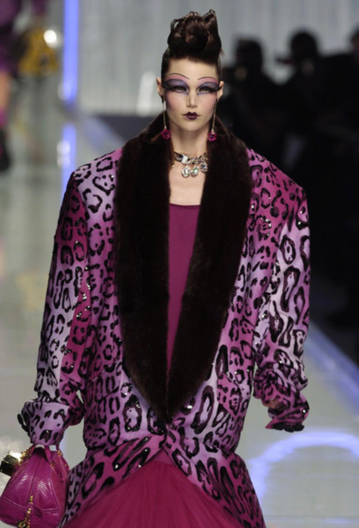 TheRealList presents: a purple cheetah print Christian Dior robe, designed by John Galliano. From the Fall/Winter 2004 'gambler' collection, this robe boasts a cheetah print that was heavily used in the collection and appeared in several runway