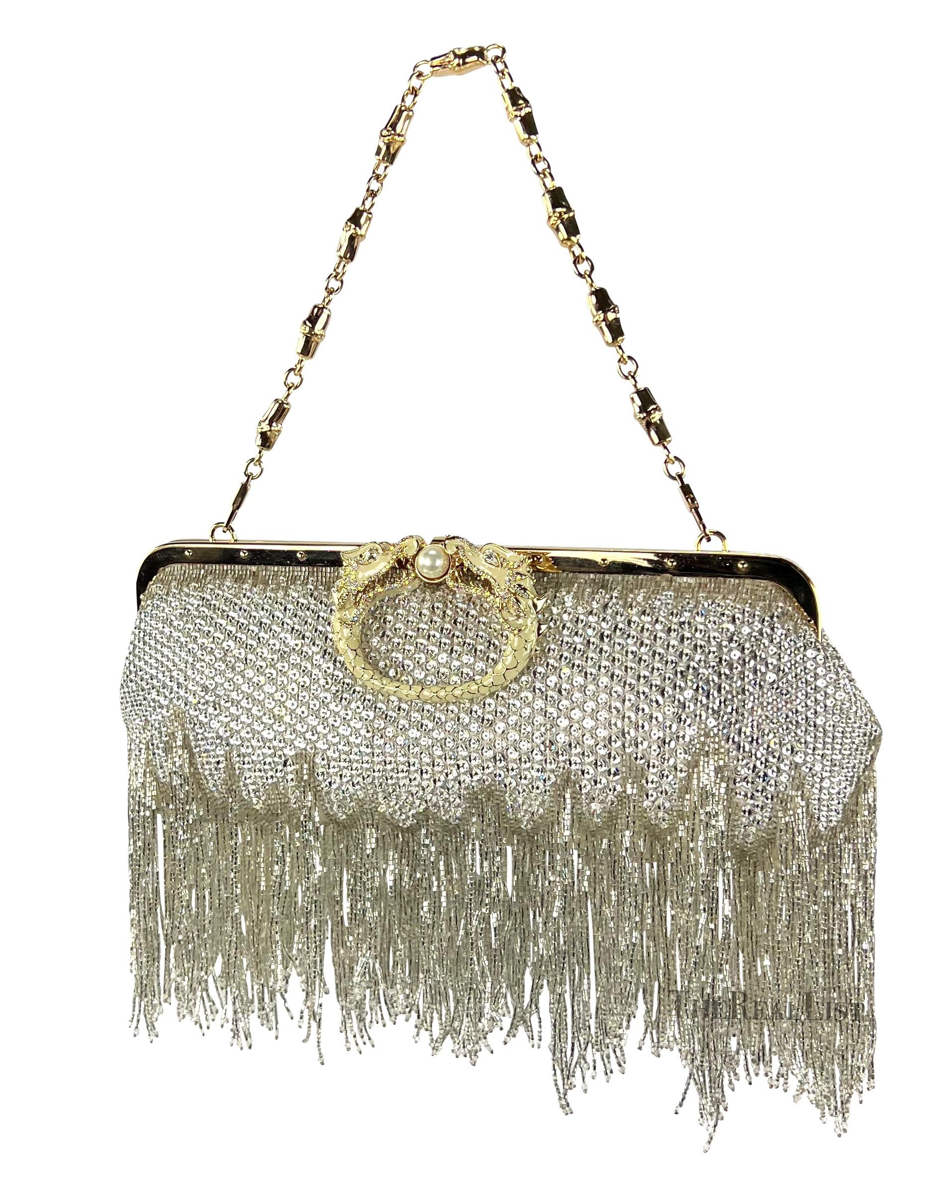 TheRealList presents: an incredible crystal beaded and rhinestone accented Gucci bag, designed by Tom Ford. Experience timeless luxury with a mesmerizing masterpiece from Ford's final collection at the house of Gucci. This extraordinary Fall/Winter