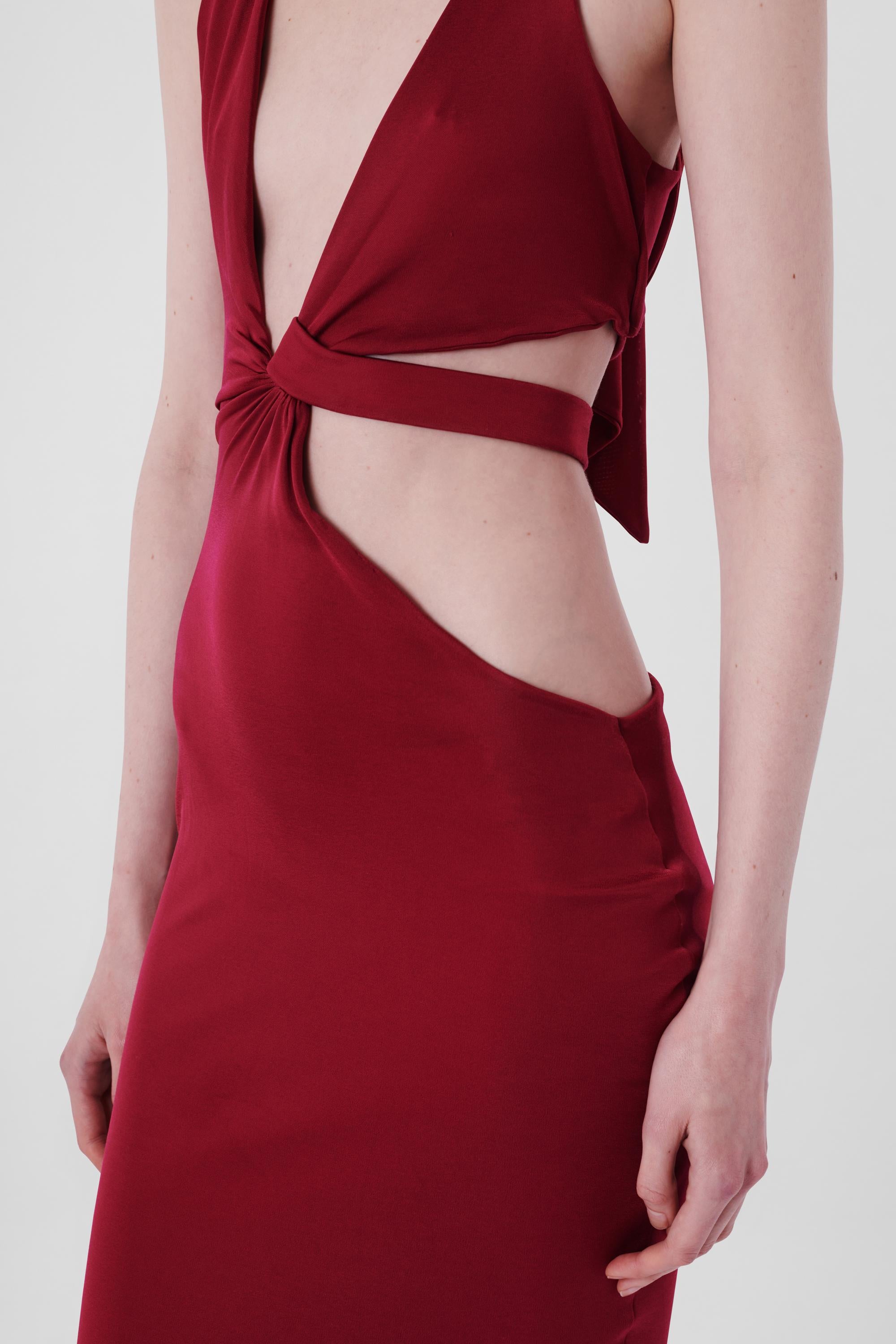 Gucci by Tom Ford F/W 2004 Maroon Cutout Bodycon Dress. Features cutout design, halter neck with adjustable strap and midi length.

Brand: Gucci
Size: UK 6
Label size: Small
Modern size: UK: 6 to 8, US: 0 to 2, EU: 34 to 36
Fabric: Viscose,