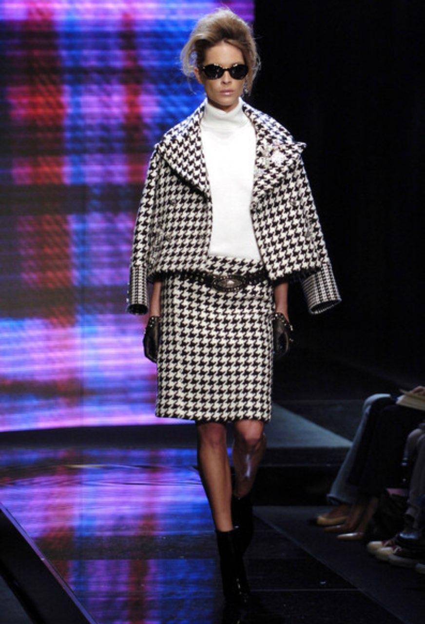 Presenting an incredible black and white Versace houndstooth tweed skirt set, designed by Donatella Versace. From the Fall/Winter 2004 collection, this set debuted on the season's runway as part of look 13 modeled by Erin Wasson. This fabulous set