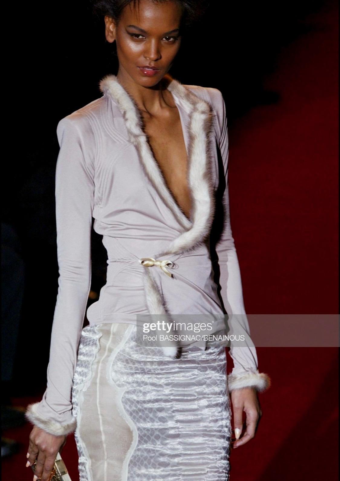 Presenting a gorgeous sleeveless top designed by Tom Ford for Yves Saint Laurent Rive Gauche's Fall/Winter 2004 collection. A reference to Yves Saint Laurent's infamous Fall/Winter 1977 'Les Chinoises' collection, Ford's iconic Fall/Winter 2004