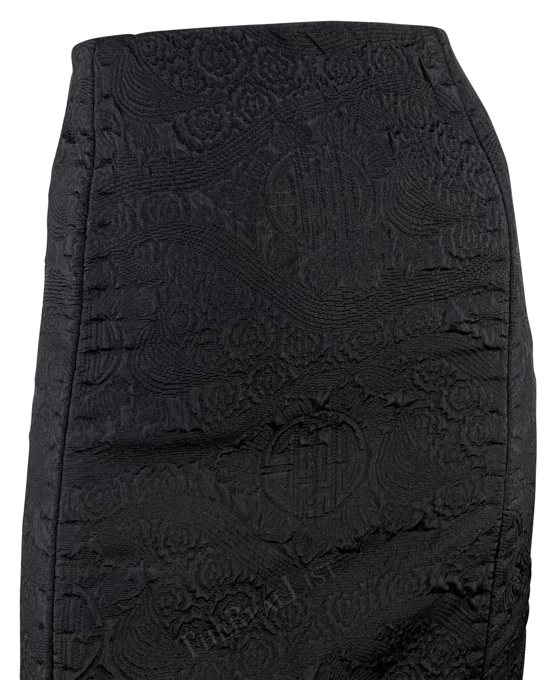 This sophisticated black chinoiserie textured pencil skirt by Yves Saint Laurent, was designed by Tom Ford for the Fall/Winter 2004 collection, marking Ford’s final season at YSL. This high-waisted skirt showcases a woven chinoiserie pattern and