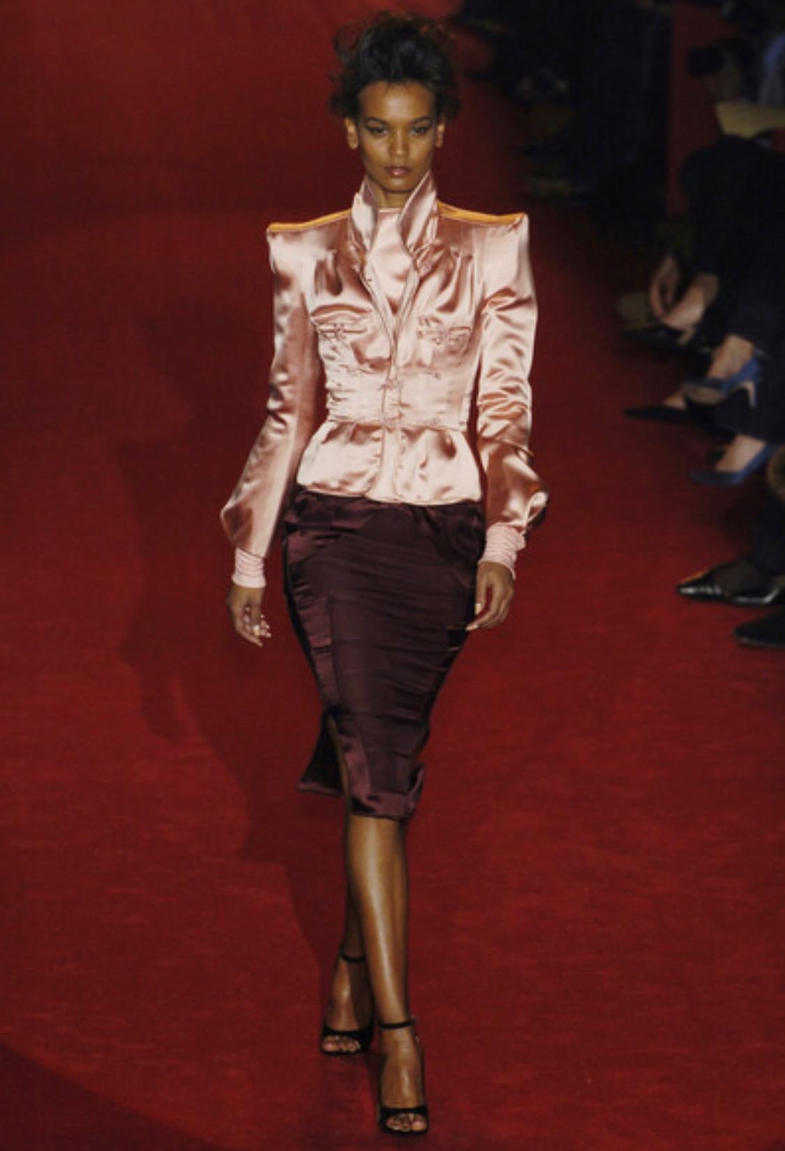 TheRealList presents: a gorgeous burgundy satin chinoiserie jacket, designed by Tom Ford for Yves Saint Laurent Rive Gauche. This gorgeous jacket was masterfully designed by Tom Ford who reintroduced exaggerated pagoda shoulders to create the