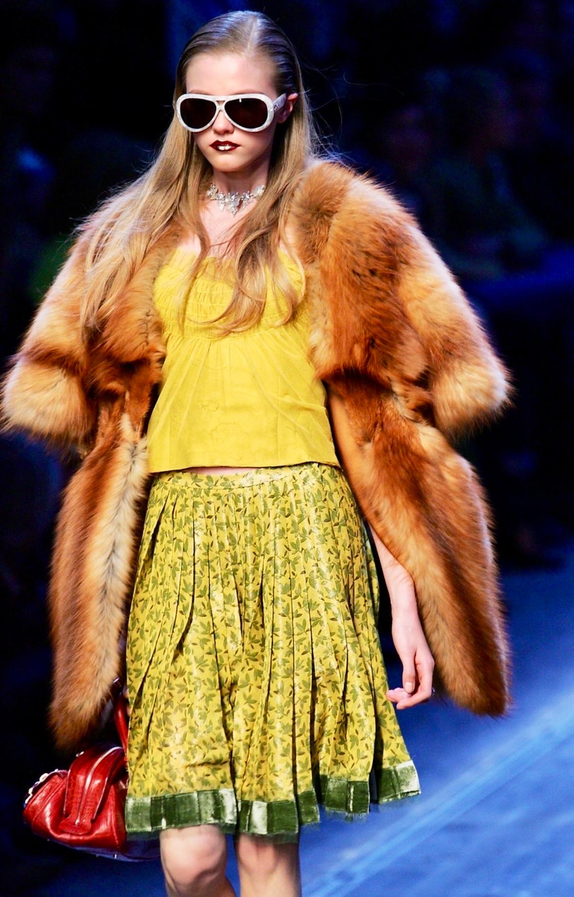 This auburn Christian Dior fox fur stole, designed by John Galliano, is a prototype/sample from the Fall/Winter 2005 collection. Worn as part of look 27 by Vlada Roslyakova. Made entirely of luxurious red fox fur, it drapes elegantly over the