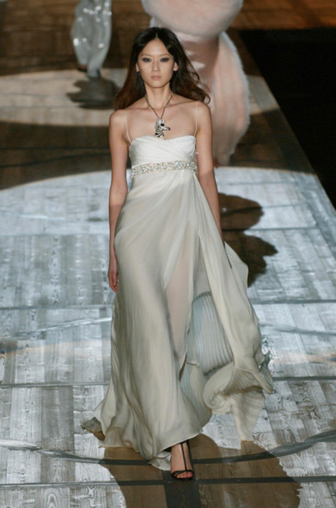 Presenting a fabulous deep purple Roberto Cavalli gown. From the Fall/Winter 2005 collection, this stunning floor-length gown debuted on the season's runway in white as look 66 modeled by Hye Park. This incredible gown was also seen on Carmen