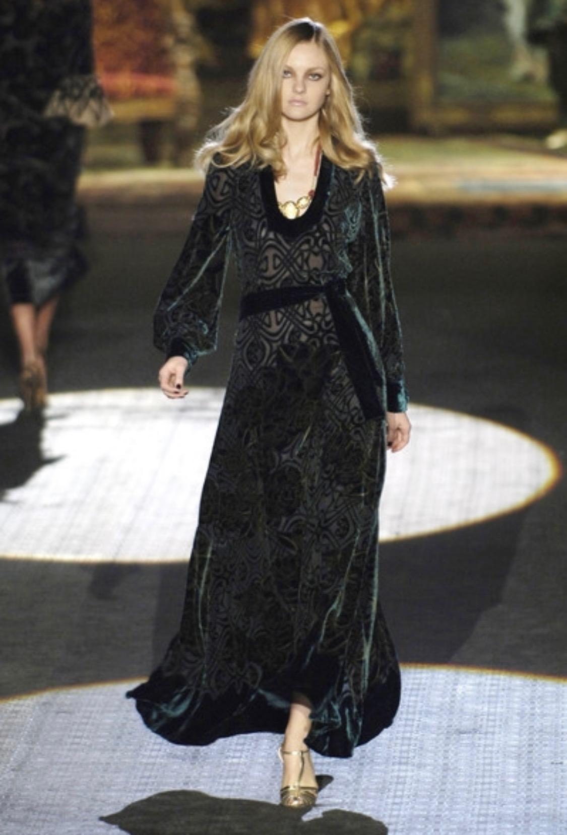 TheRealList presents: a gorgeous full-length wrap gown in velvet silk designed by Roberto Cavalli for his Fall/Winter 2006 collection, debuting as look number 3 worn by Caroline Trentini. This piece is an excellent representation of this collection,