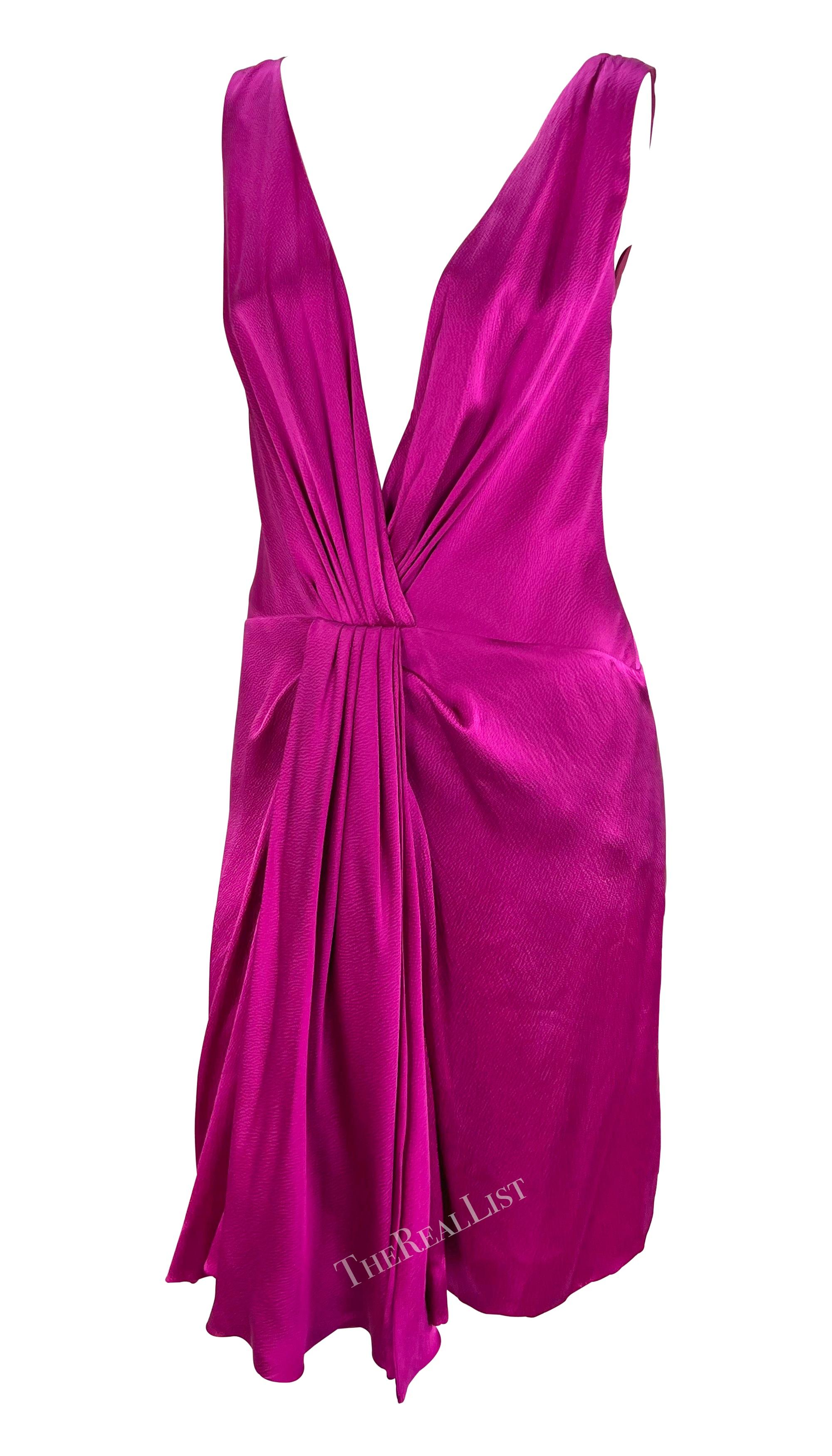Introducing a stunning fuchsia strapless mini dress by Christian Dior, designed by John Galliano for the Fall/Winter 2007 collection. Crafted from crepe silk satin, this dress boasts an alluring plunging neckline. The strapless dress gathers at the