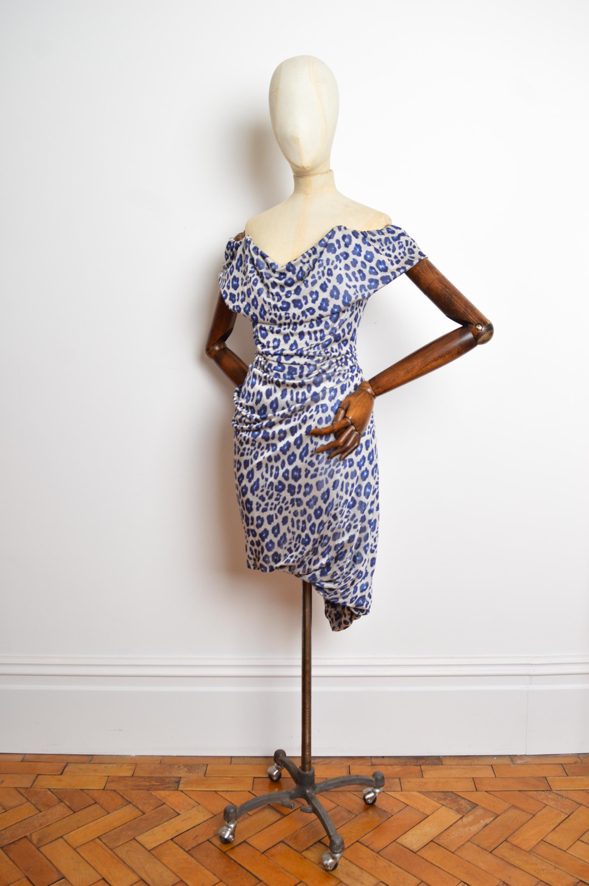 A fabulous Vivienne Westwood cocktail dress with built in corset structure from the Fall / Winter 2011 collection featuring a boned, figure hugging silhouette. 
Size; Medium (UK10) 
Measurements are provided in inches (‘’)
Pit to Pit; 18”
Top of