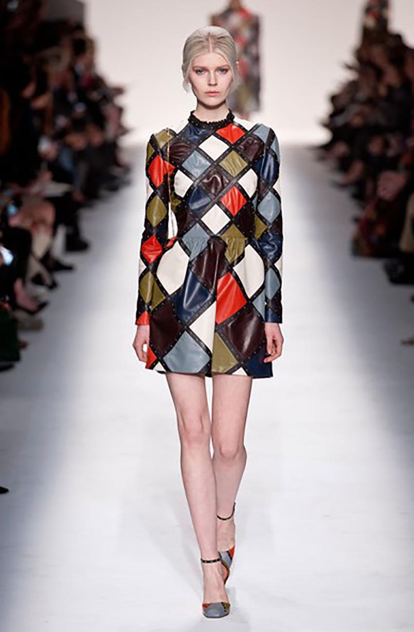 VALENTINO

Collection F/W 2014 L#48

Inspired by Italian Pop Art, this harlequin dress from Valentino features a vibrant mix of rich-hued leather.
Black studded trim, 
long sleeves
multicolored

Size IT 38 - US 2

 Pre-owned, excellent condition! 

