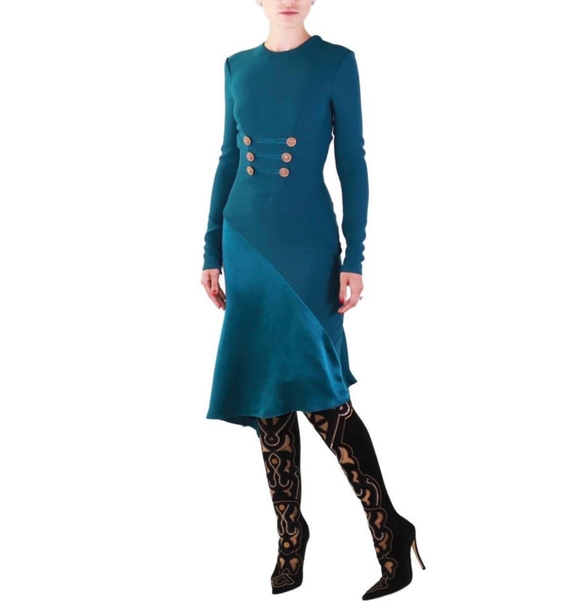 VERSACE
Actual runway sample Fall/Winter 2014 look # 2
Blue teal dress with gold-tone crystal embellished buttons.
Back zipper, long sleeves
Content: 100% silk,outer fabric: 100% viscose,lining: 100% silk.
IT Size 38 - US 2
armpit to armpit
