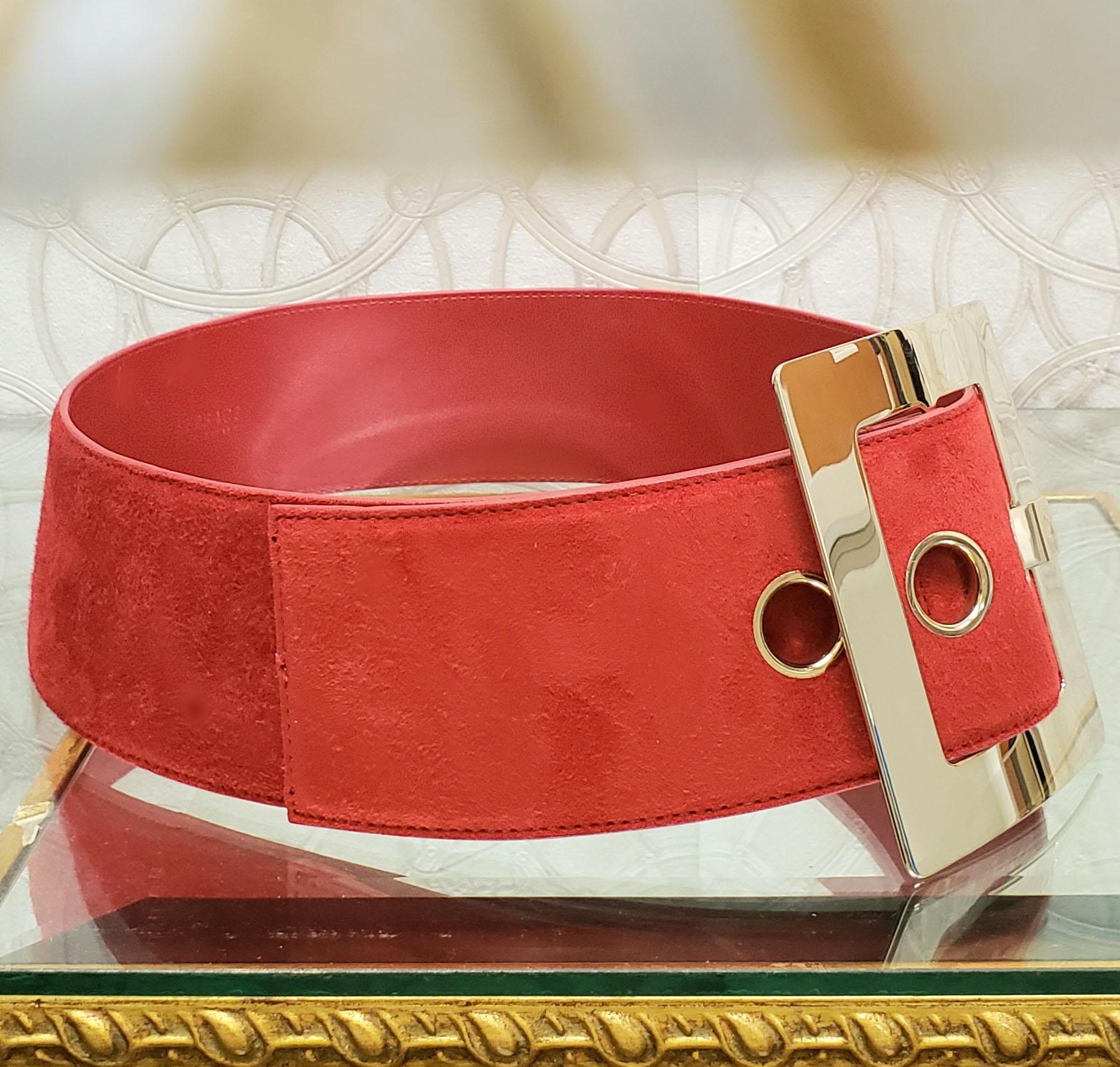 red belt with gold buckle
