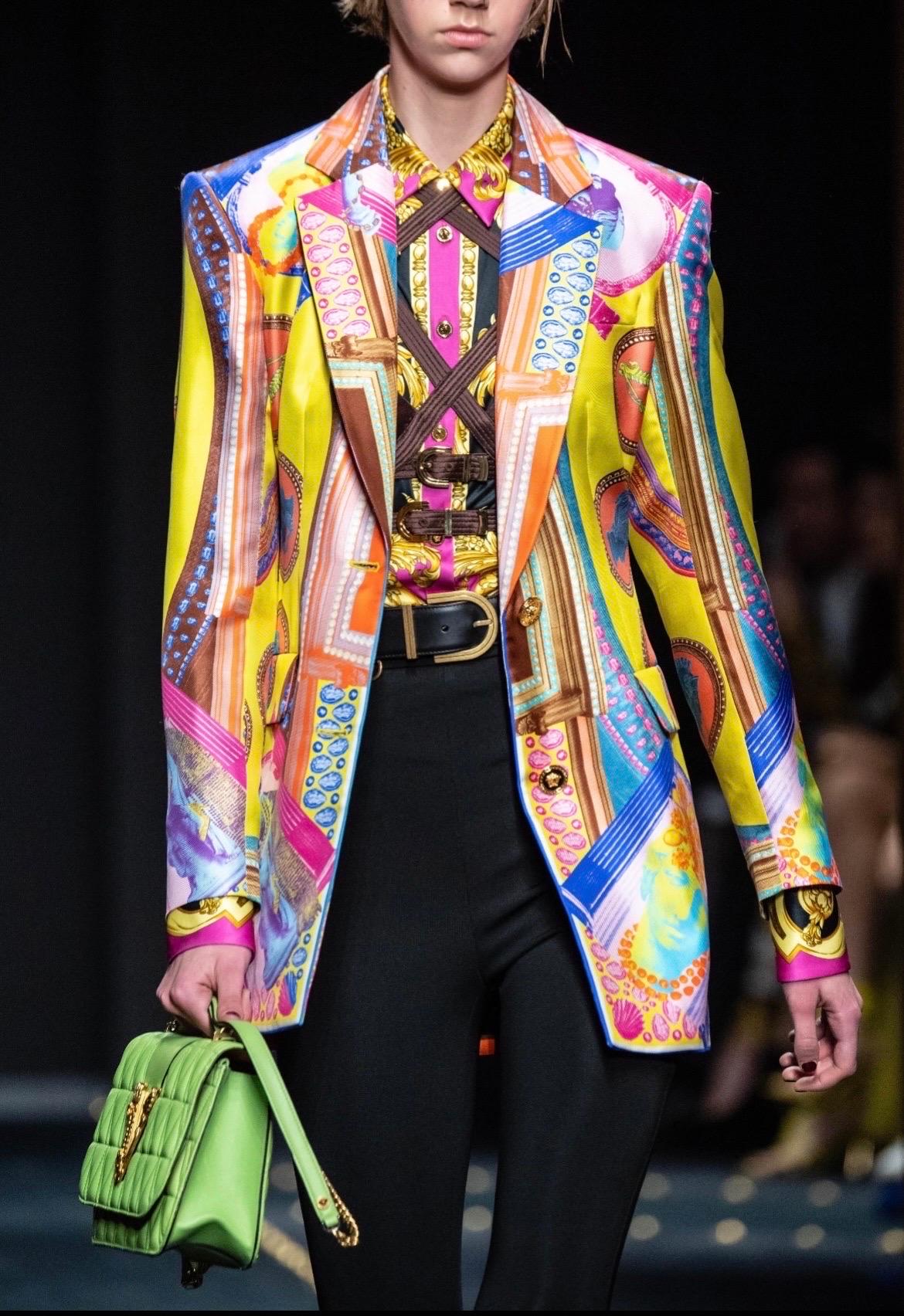This spectacular Versace multicolored “Vittoria” silk blazer features shoulder pads, long sleeves, buttoned cuffs, & three front pockets
As seen on the Fall Winter 2019 runway
Gold tone medusa button front
100% Silk
Made in Italy

Size: