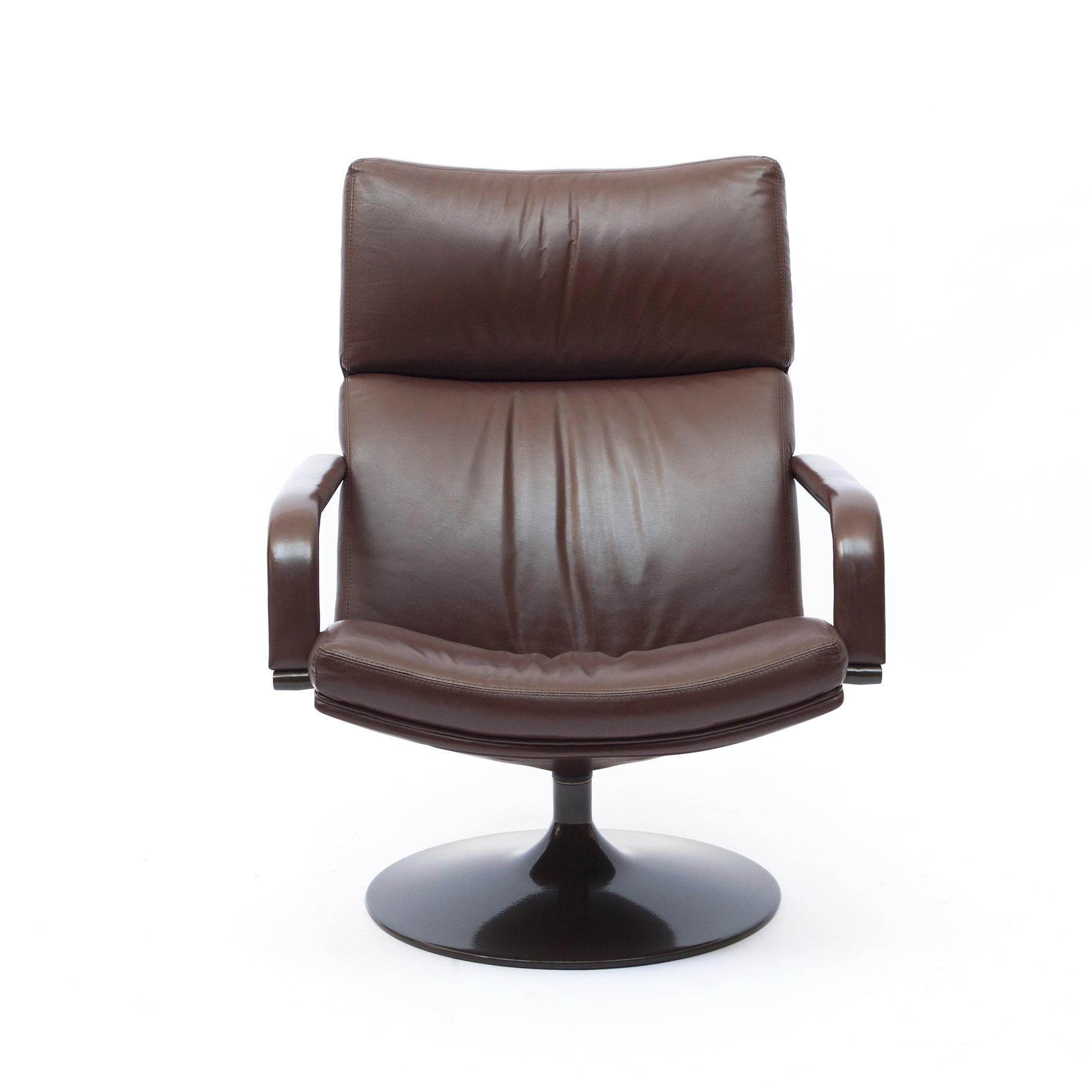 Braun leather armchair with metal frame by Geoffrey Harcourt. The stylish leather covers both of the arms as well as the bottom and back of chair. Good original condition. A luxury chair for day-dreaming, relaxing or holding a conversation.