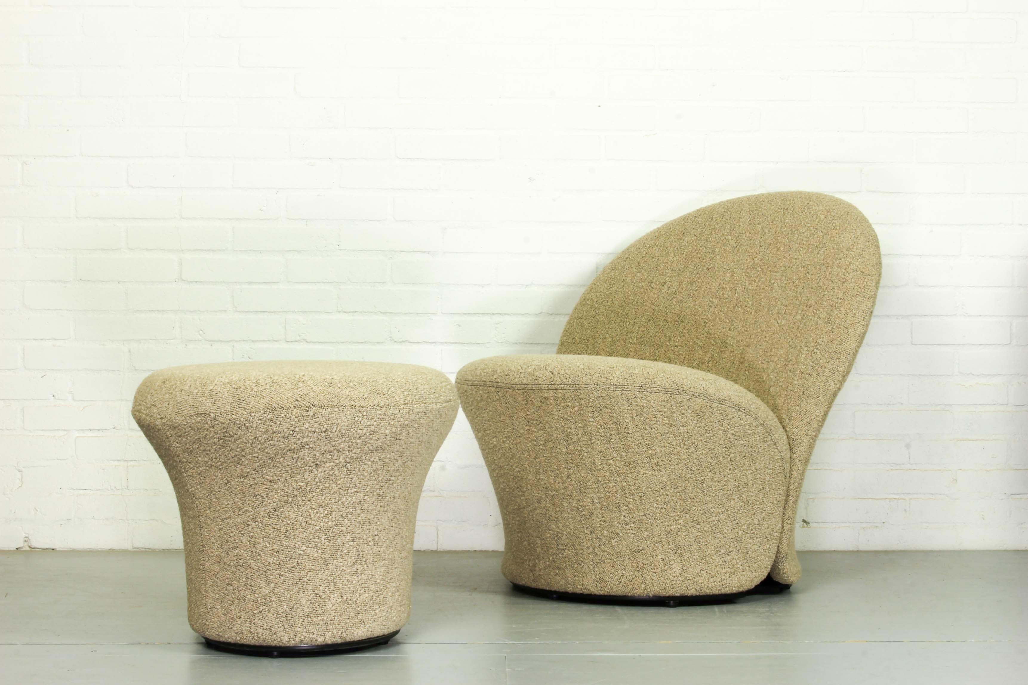 This set of sculpted chair and ottoman was designed by Pierre Paulin in 1967 and produced in the Netherlands by Artifort. This rare chair was only produced for one year from 1967-1968. It is made of steel and wood and features new nubby bouclé