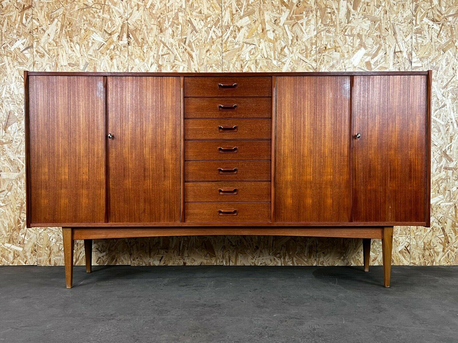 F60s 70s teak sideboard credenza highboard Danish Design Denmark 60s 70s

Object: sideboard

Manufacturer:

Condition: good

Age: around 1960-1970

Dimensions:

220cm x 45.5cm x 119cm

Other notes:

The pictures serve as part of the