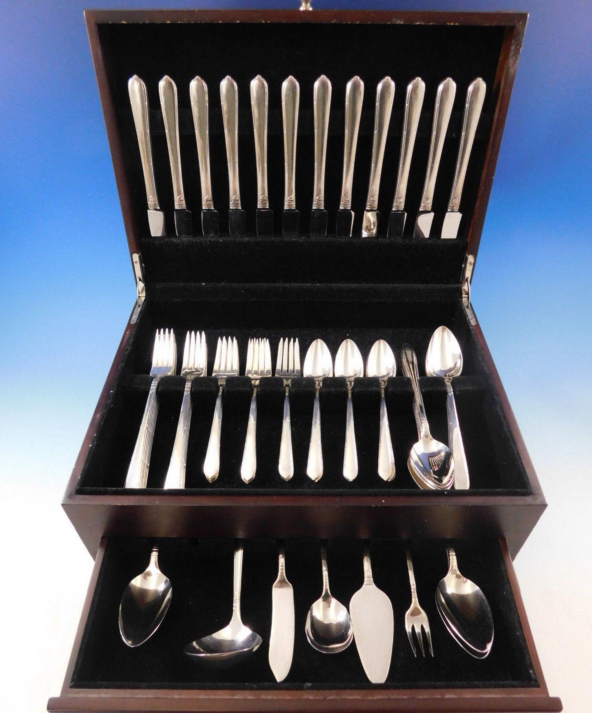 Grille size Berkley square by community Oneida circa 1935 silver plate flatware set, 68 pieces. Grille size knives and forks have elongated handles and short blades/tines. This set includes:

12 grille size knives, 8 3/8