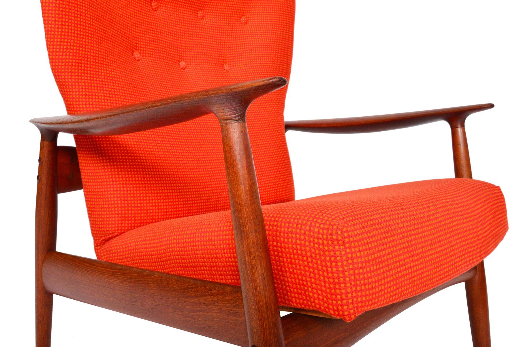 Boldly designed, this ingenious high back lounge chair was conceptualized by Kay Rasmussen for Peter Wessel in the 1960s. The subtle winged high back design offers a spacious yet cozy seating experience. A beautifully sculpted teak frame supports