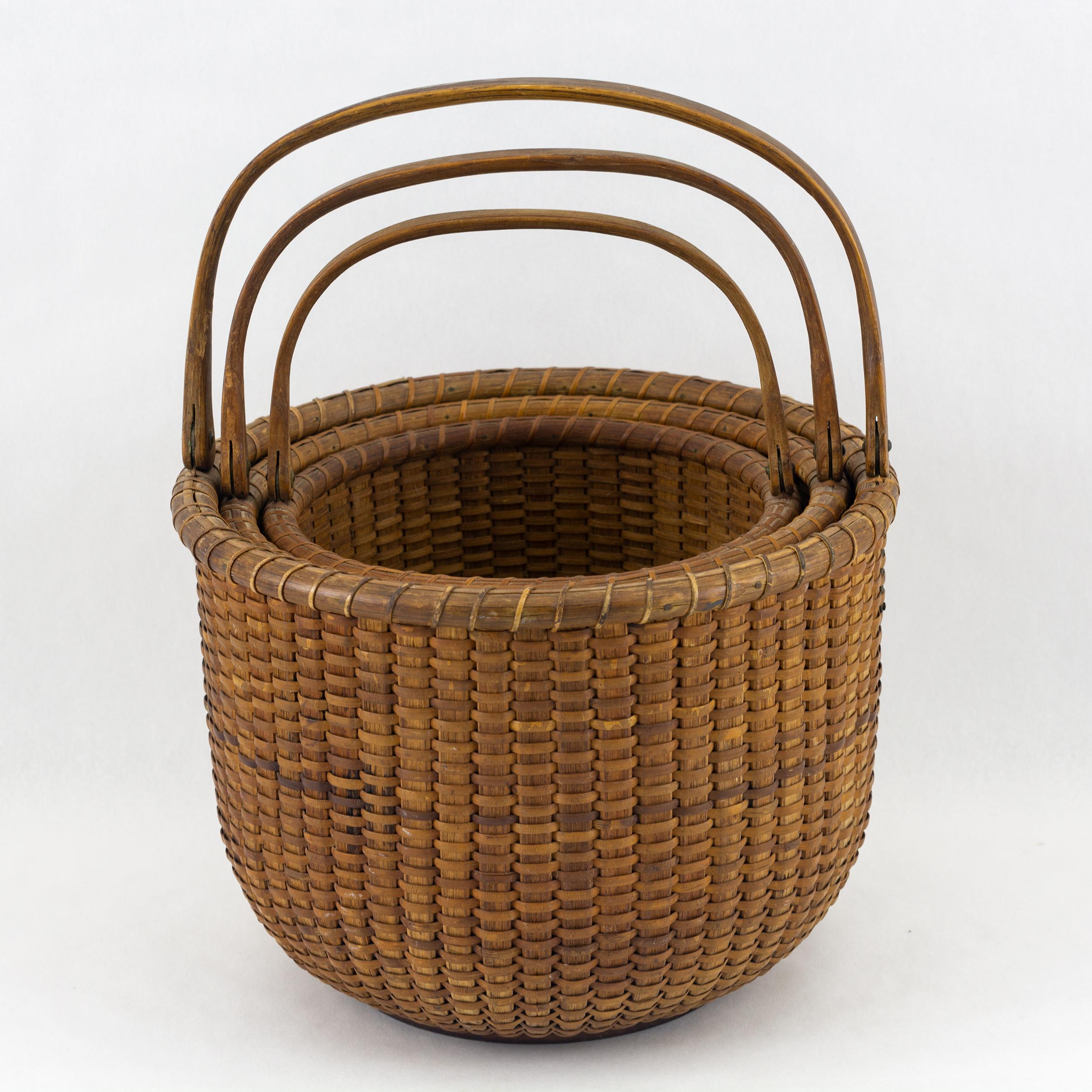 Three woven Nantucket lightship baskets, more than likely part of a larger nesting set.
Attributed to Captain Andrew J. Sandsbury (1830-1902). All three baskets are in original condition and showing there dark rich patina. The largest is 8