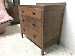 Heals Attributed a Limed Oak Petite Chest of Three Drawers with Ebonized Handles