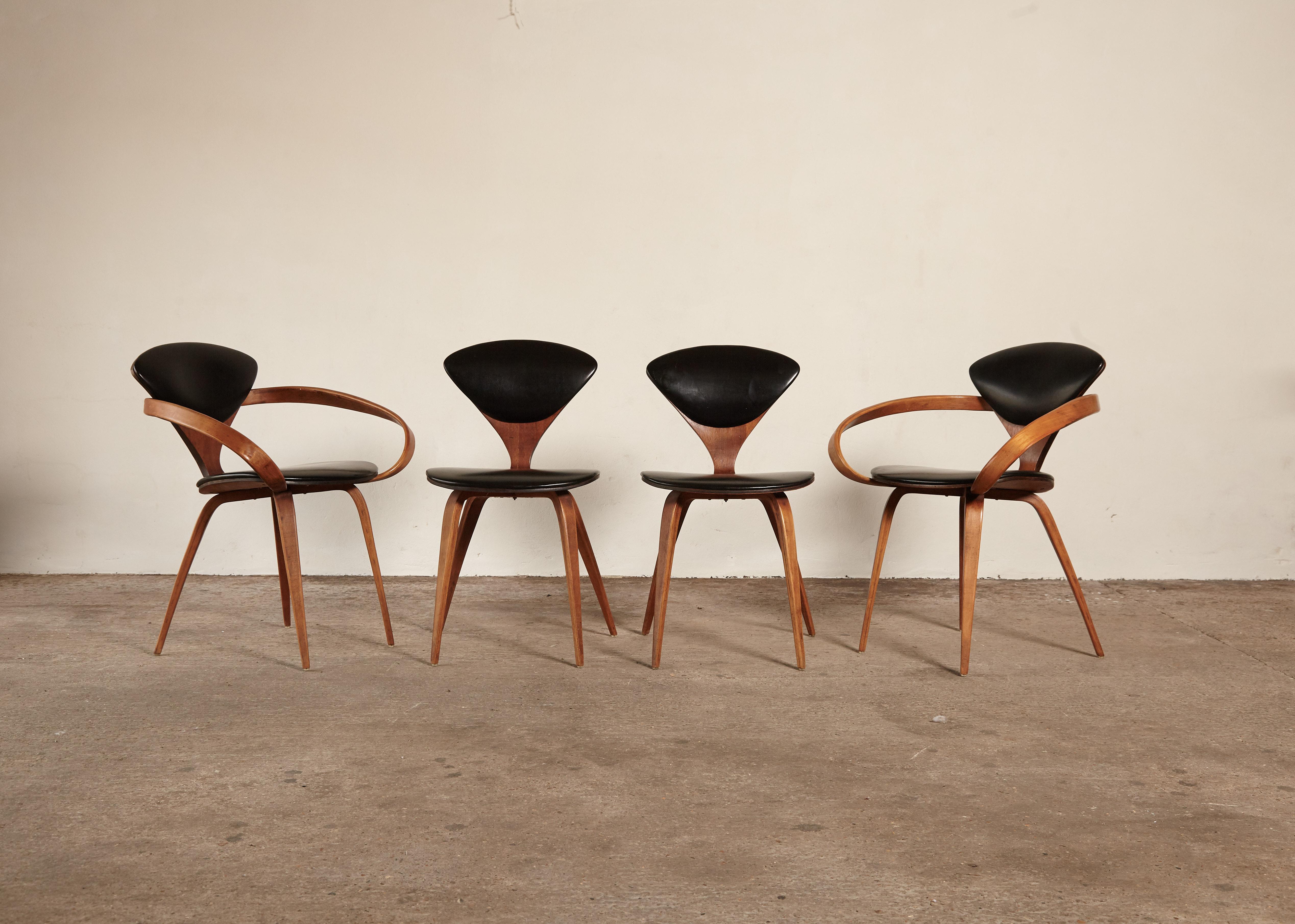 A set of four original Norman Cherner dining chairs, made by Plycraft, USA in the 1960s. Bentwood frames, original vinyl seats. Plycraft labels to the undersides. We offer a re-upholstery service if you would like the seat pads to be a different