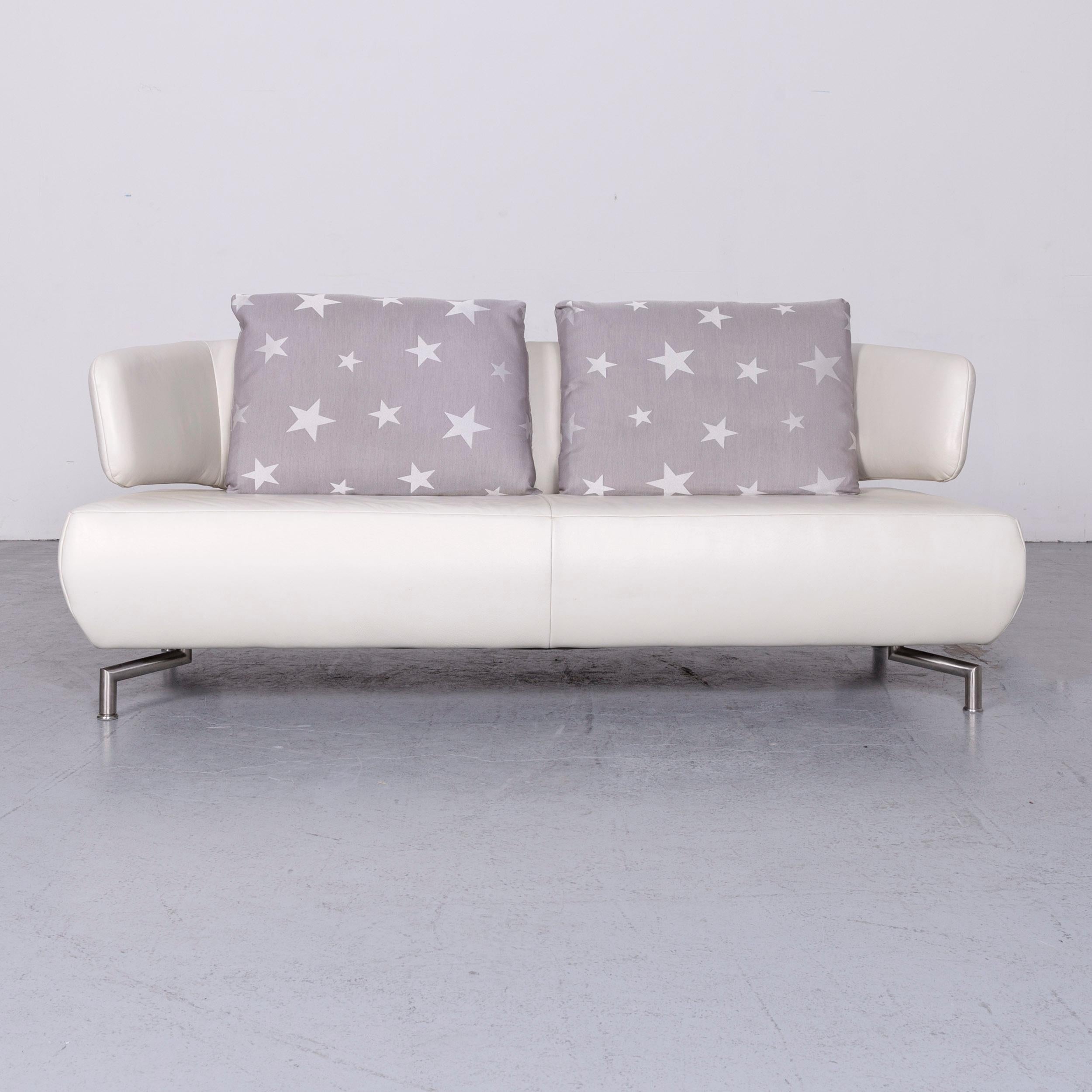 We bring to you a Koinor designer two-seat sofa white leather couch with pillow.