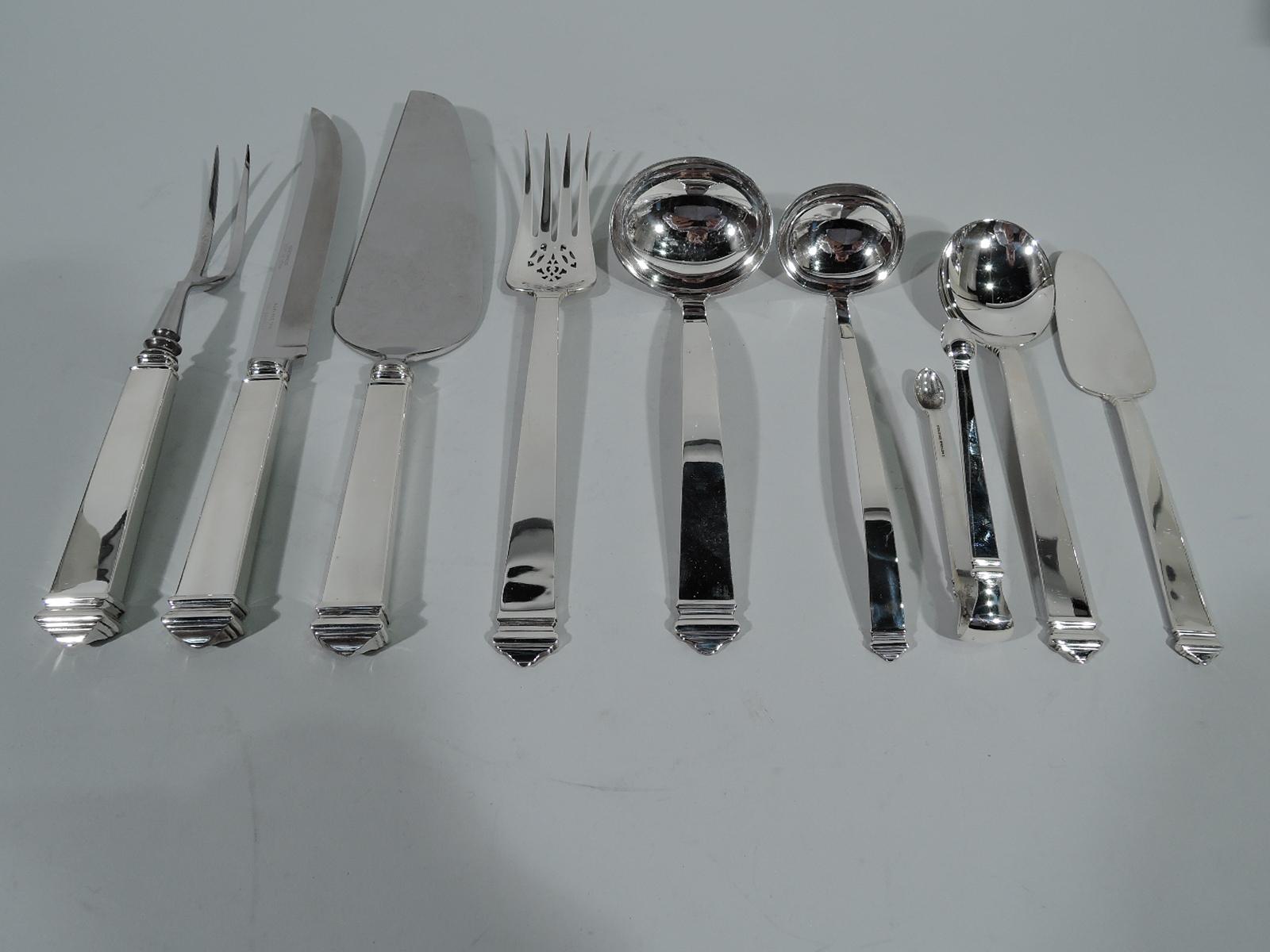 Sterling silver dinner set for eight in Hampton pattern. Made by Tiffany & Co. in New York. This set comprises 92 pieces (dimensions in inches): Forks: Eight dinner forks (7 3/4), three luncheon forks (7), nine salad forks (6 7/8), and four seafood