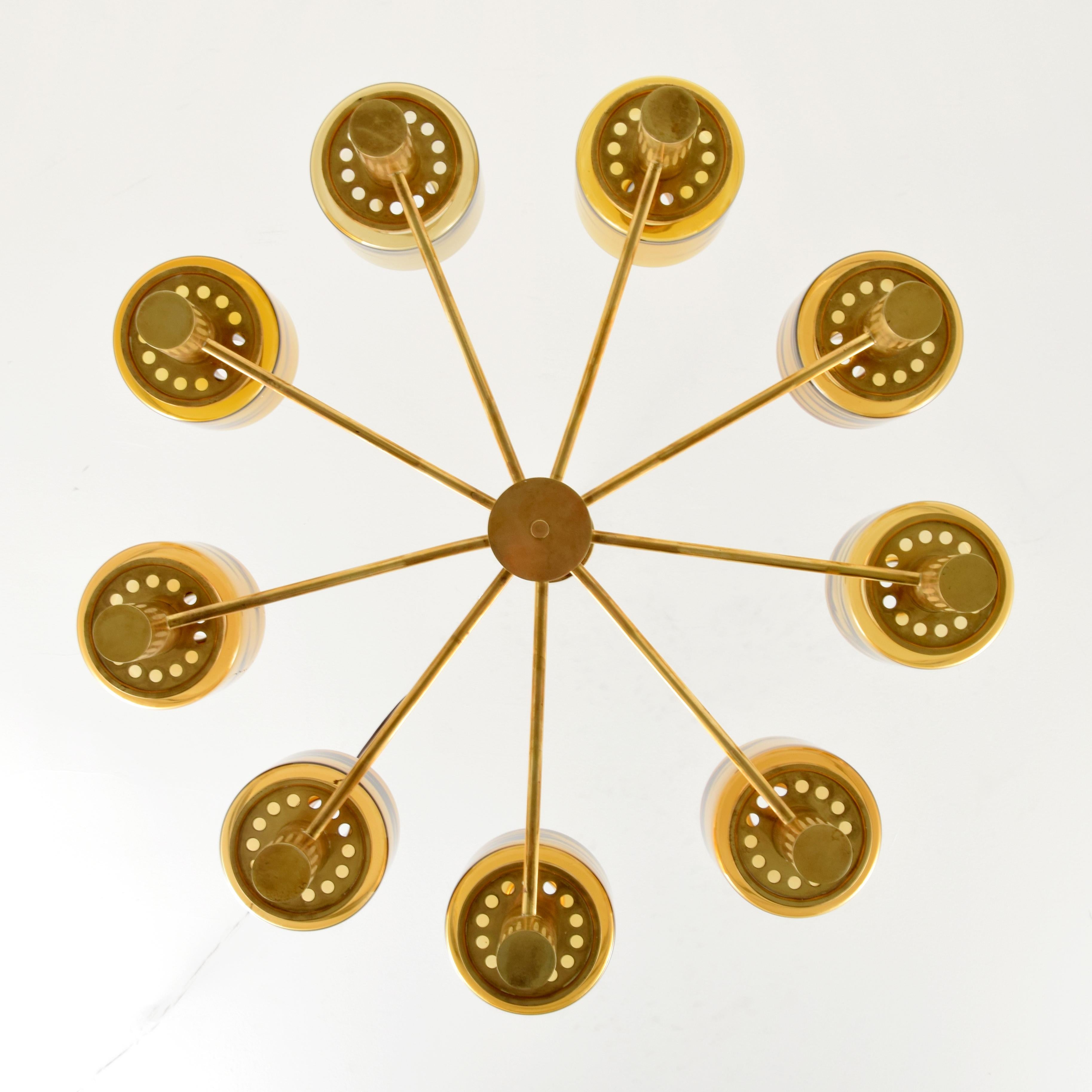 Nine-arm brass chandelier with amber glass Hans-Agne Jakobsson from Vancouver International airport.
 