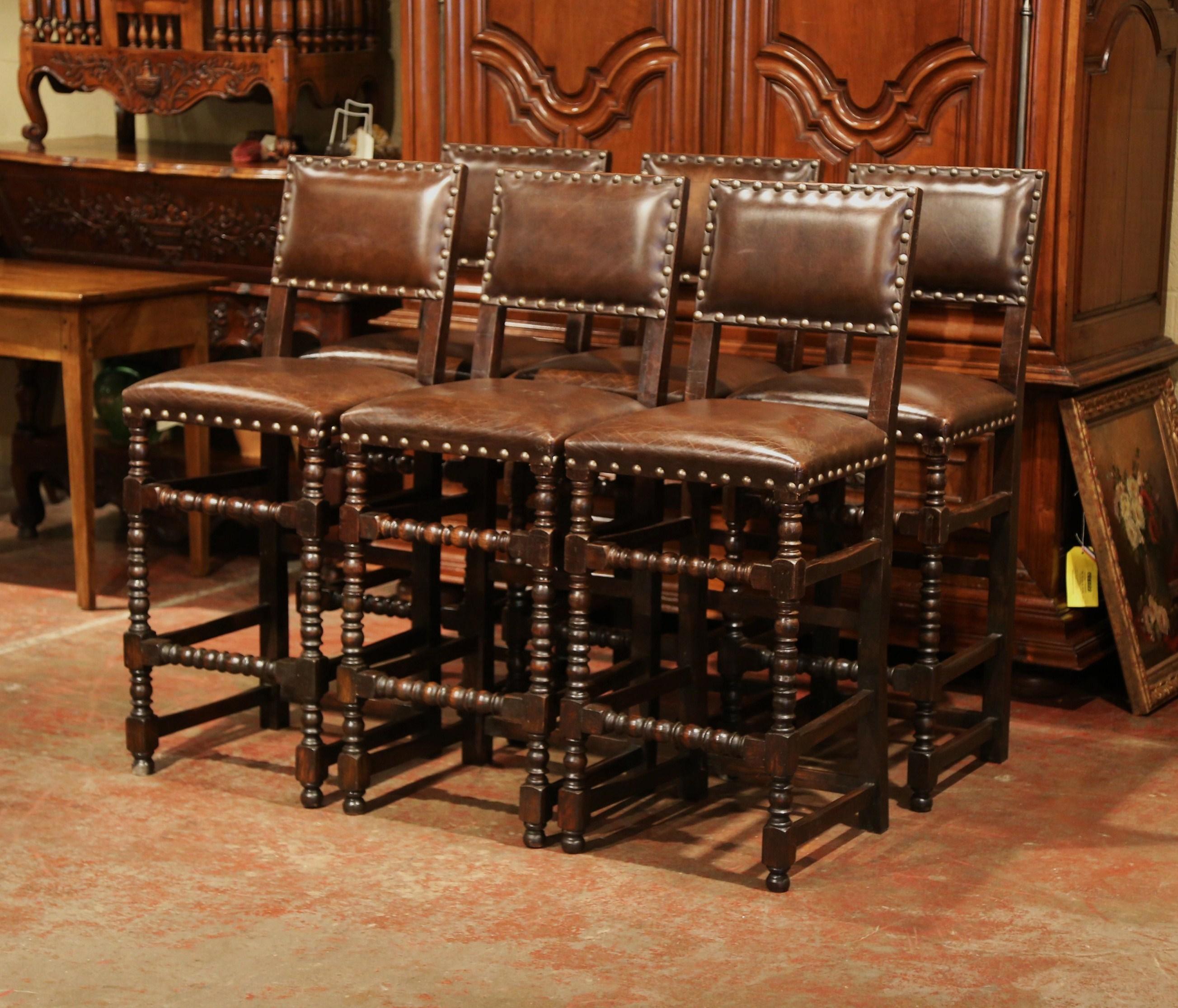 Add a Gothic look to your bar or counter with this elegant set of six antique stools. Crafted in France circa 1890, the high chairs are the perfect height for a 42 to 45