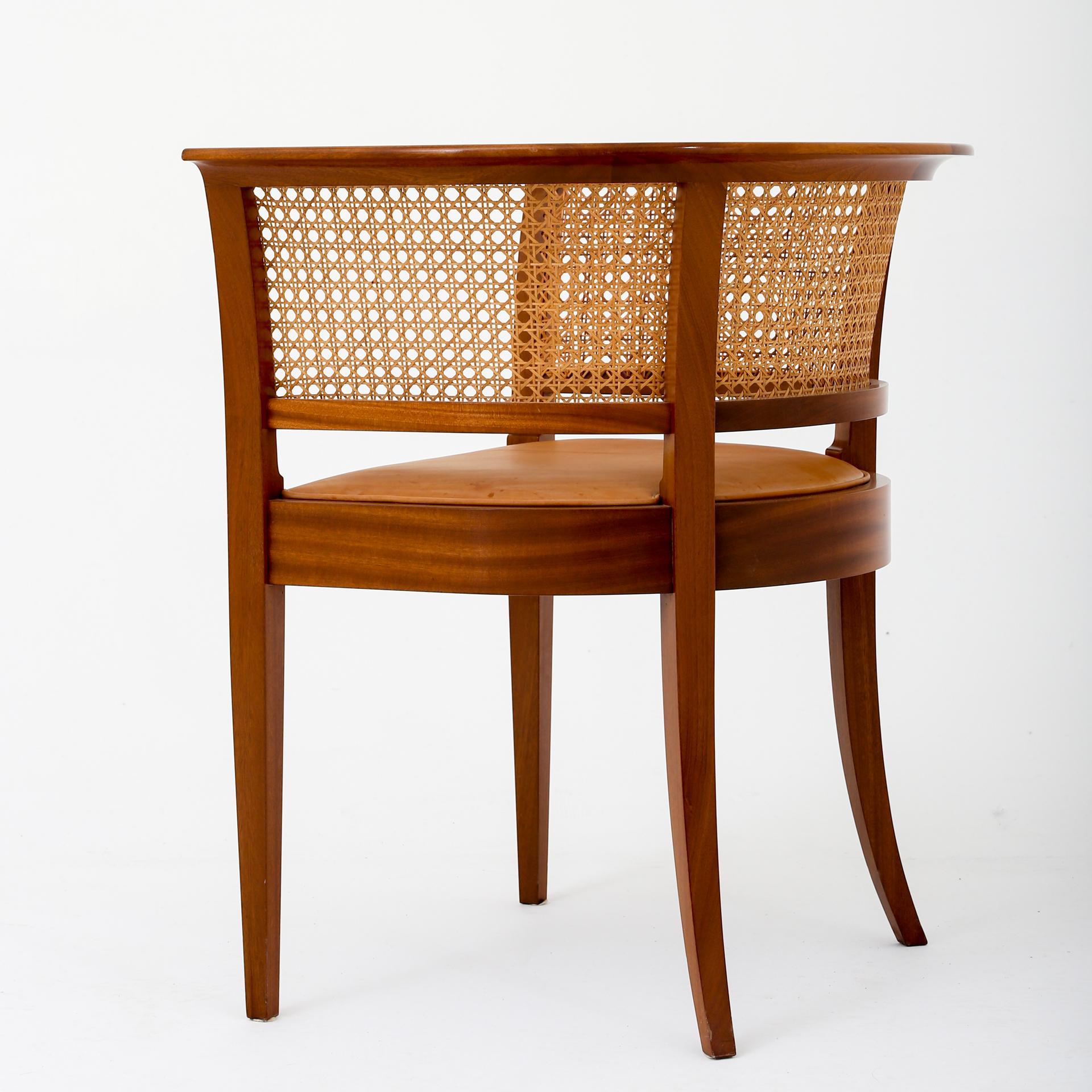 Kaare Klint and Rud. Rasmussen. Model 9662 - 'Faaborg' chair in mahogany with seat in light leather.