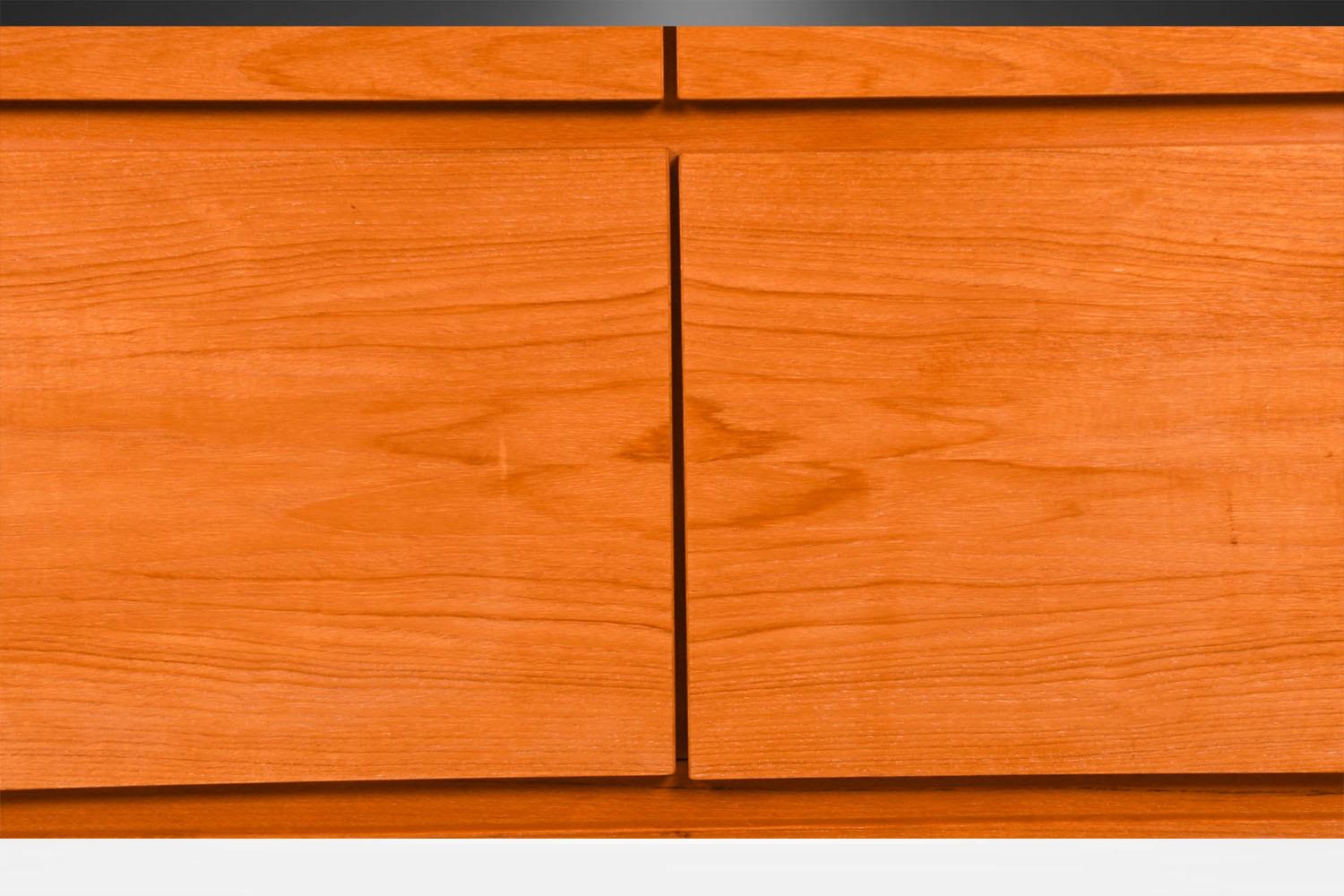 An absolutely stellar, classic Danish teak sideboard/credenza designed by Ib Kofod-Larsen, manufactured by Faarup Møbelfabrik, circa 1960. Made in Denmark, this stunning piece, Model FA 66, features beautiful teak wood grain and sleek Danish design.