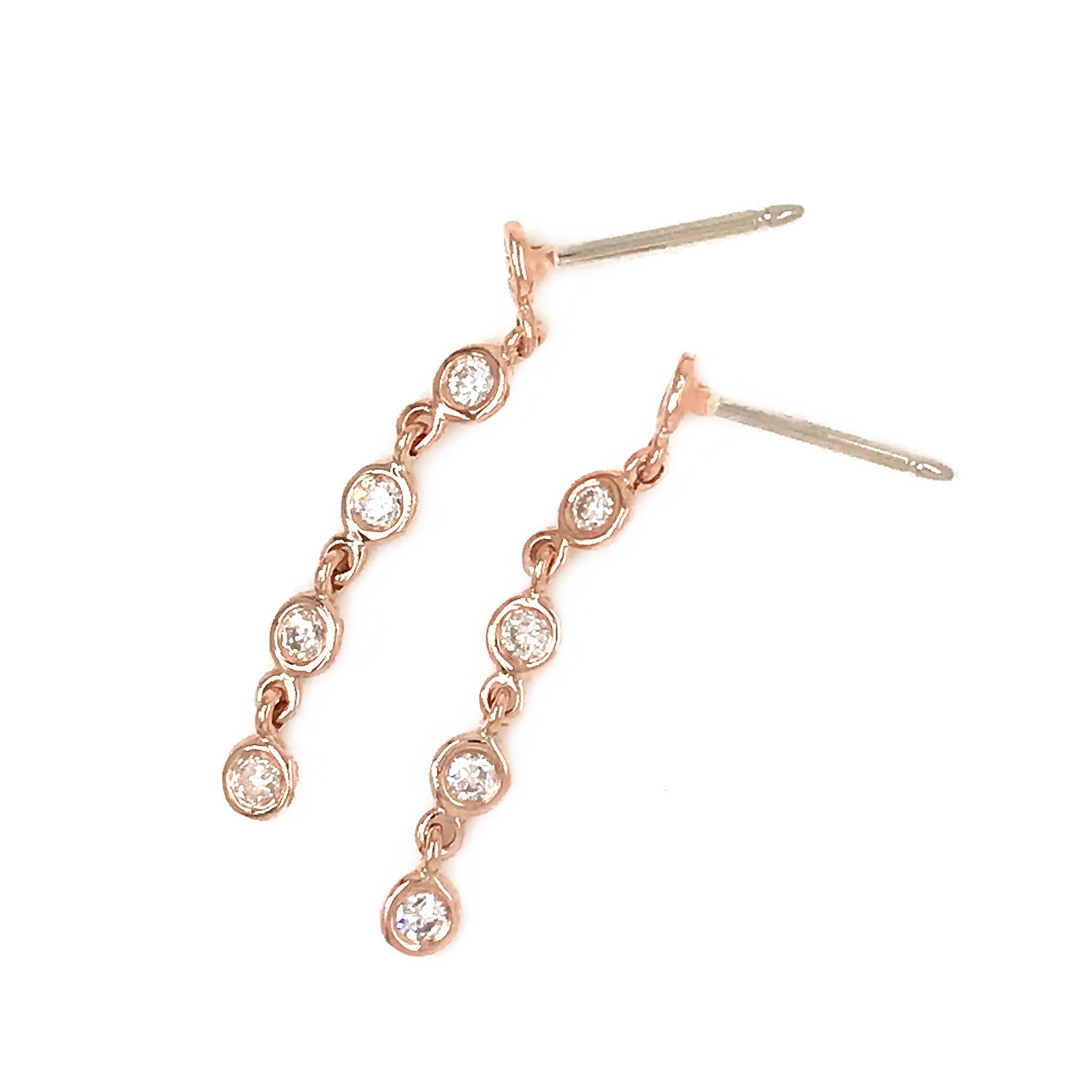 Oro rosa 14k
Diamante: 0.48 ct twd
Peso totale: 1.6 grammi
Lunghezza orecchini: 1,10 pollici