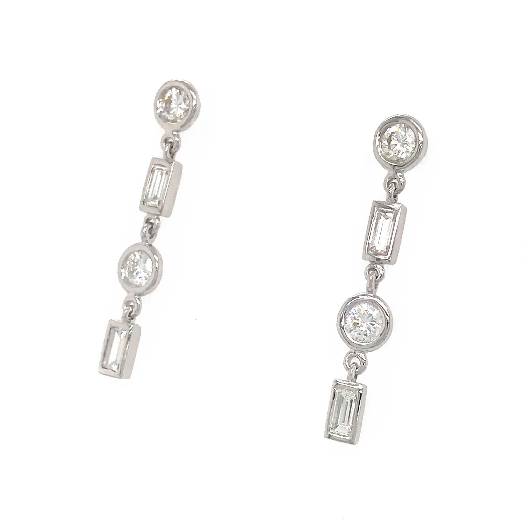 METAL TYPE: 14k White Gold
STONE WEIGHT: Rounds = 1.35ct twd
                             Baguettes = 0.69ct twd
TOTAL WEIGHT: 2.5 grams
EARRINGS LENGTH: 1.15 inches