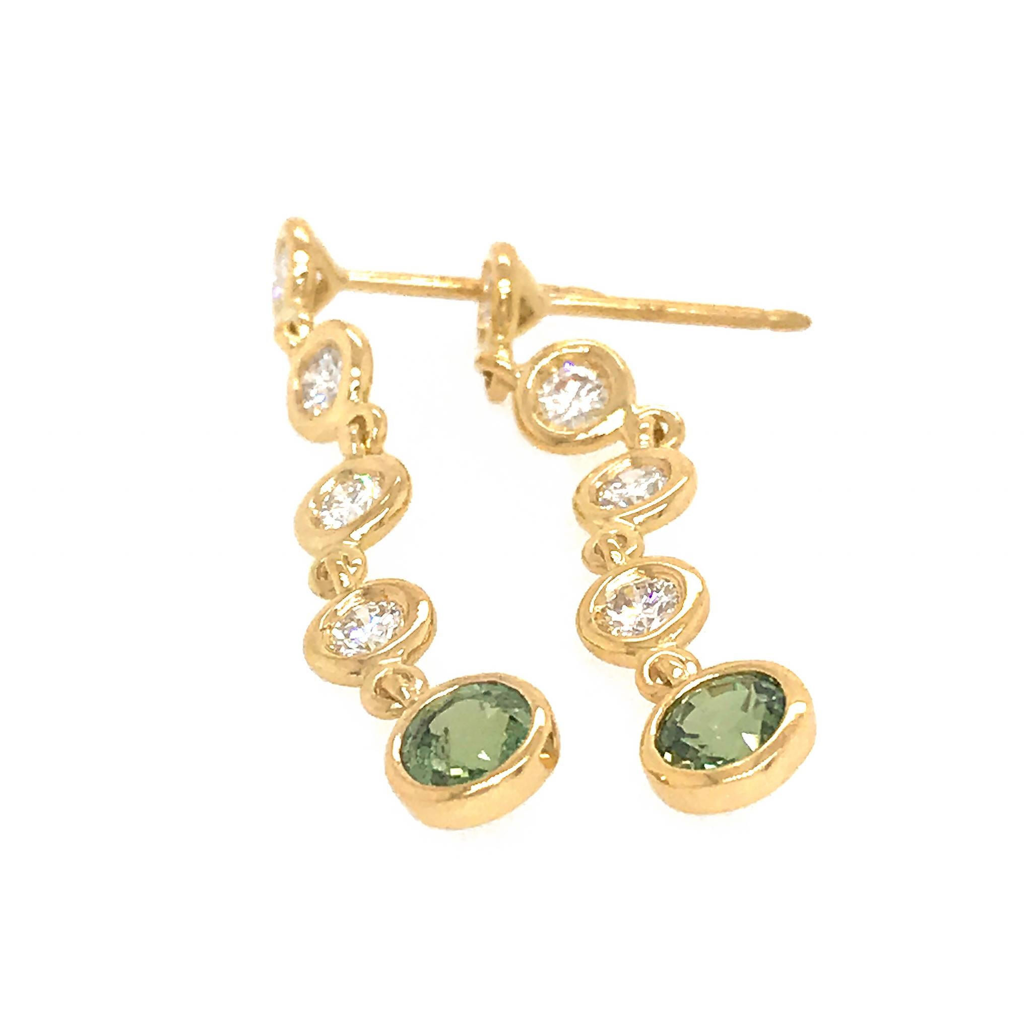 18K Yellow Gold
Diamond: 0.71 ct twd (Diamond)
Green Sapphire: 1.19 ct twd
Total Weight: 3.4 grams
Earrings Length: 1.5 inches