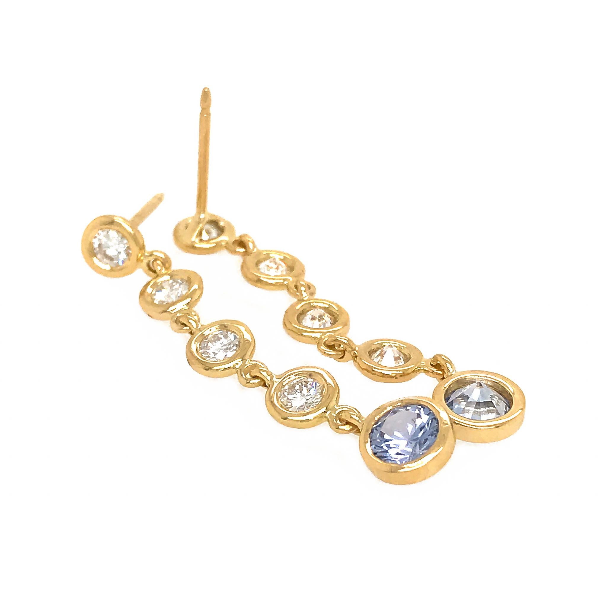 18K Yellow Gold
Diamond: 0.90 ct twd (Diamond)
Light Blue Ceylon Sapphire: 1.10 ct twd 
Total Weight: 3.7 grams
Earrings Length: 1.5 inches