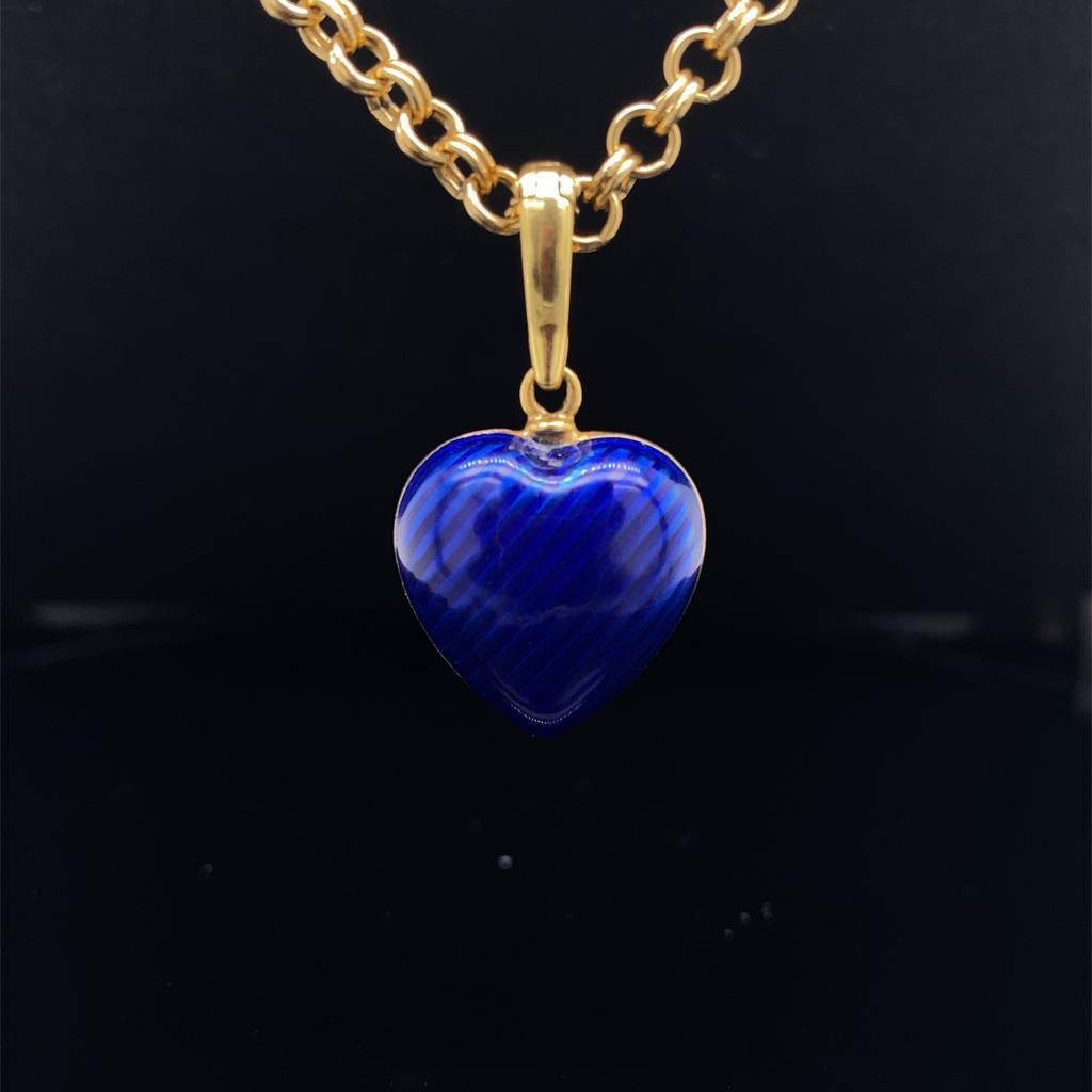 A modern Fabergé 18 karat yellow gold enamel diamond set heart pendant together with chain.

Comprising of a 18 karat yellow gold bright blue enamel heart pendant with a central diamond set three leaf clover.
The pendant includes an 18ct yellow gold