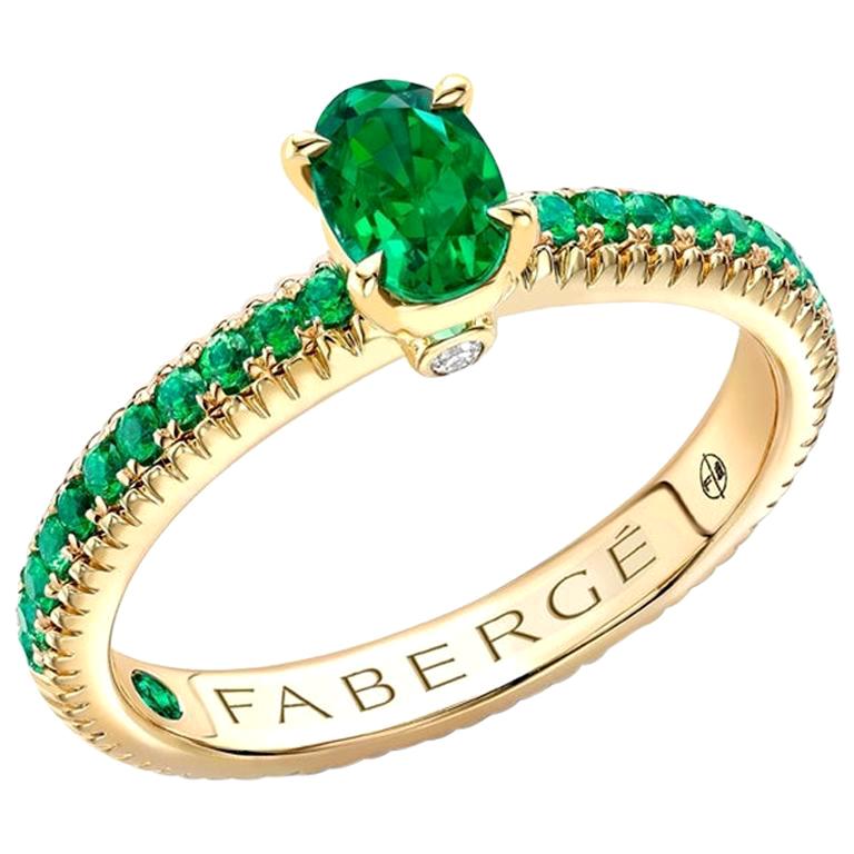 Fabergé 18k Yellow Gold Oval Emerald Fluted Ring with Tsavorite Shoulders For Sale