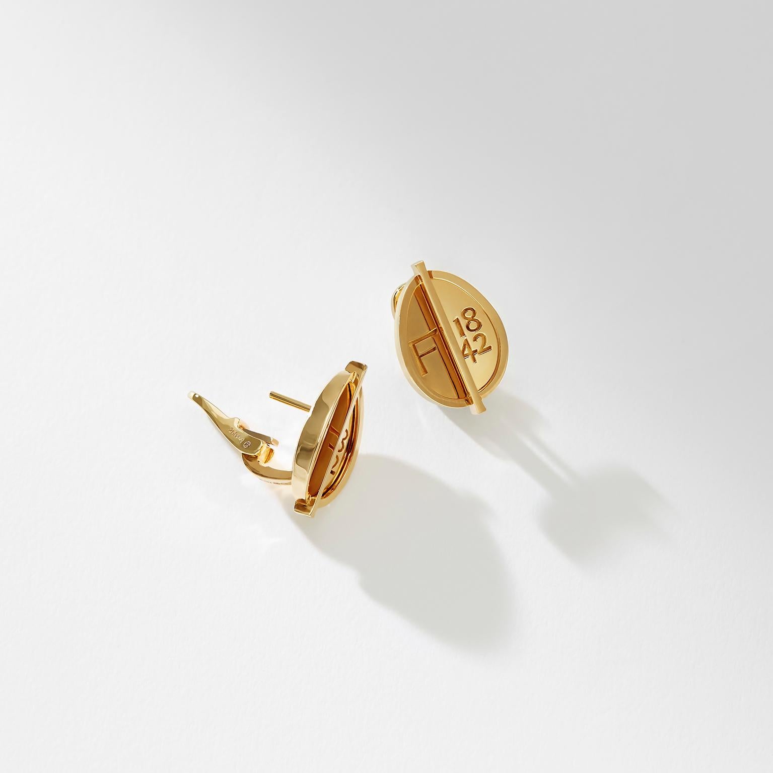 These Fabergé 1842 Yellow Gold Grande Egg Stud Earrings feature the Fabergé hallmark set in polished 18 karat yellow gold. The eggs measure 12mm in height and 3mm in depth. These earrings stack perfectly with the smaller Fabergé 1842 Yellow Gold Egg