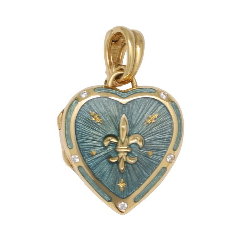 Authentic Fabergé 18k yellow gold heart locket - light blue guilloche enamel, 4 diamonds 0,075 ct G/IF with original certificate of authenticity

This locket features a 