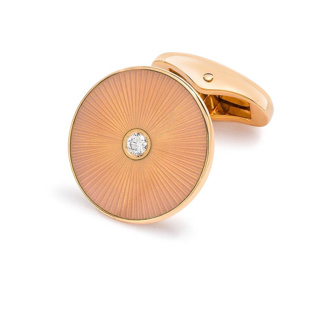 These Modern Faberge 18 karat rose gold cuff links have a soft peach guilloche enamel. Each cuff link has a round brilliant diamond center in a bezel setting. 
Total diamond weight 0.12cts. Limited to 180 pieces
The diameter is 18 mm.
Signed Faberge