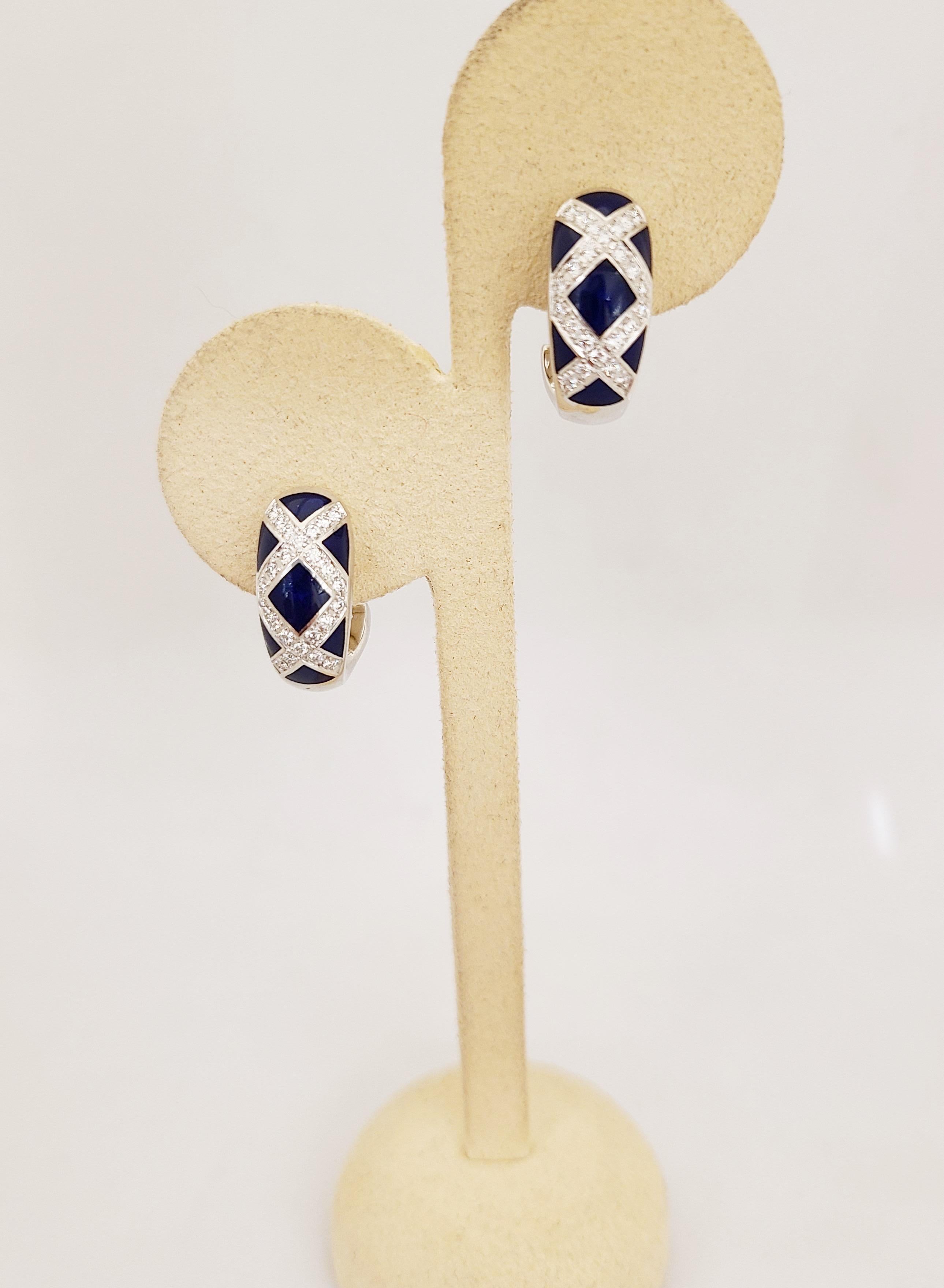 These stunning modern 18 karat white gold, diamond and blue enamel earrings were created by Victor Mayer for Faberge. Crafted in the tradition of the original House of Faberge, with meticulous attention to detail, these earrings are classic and