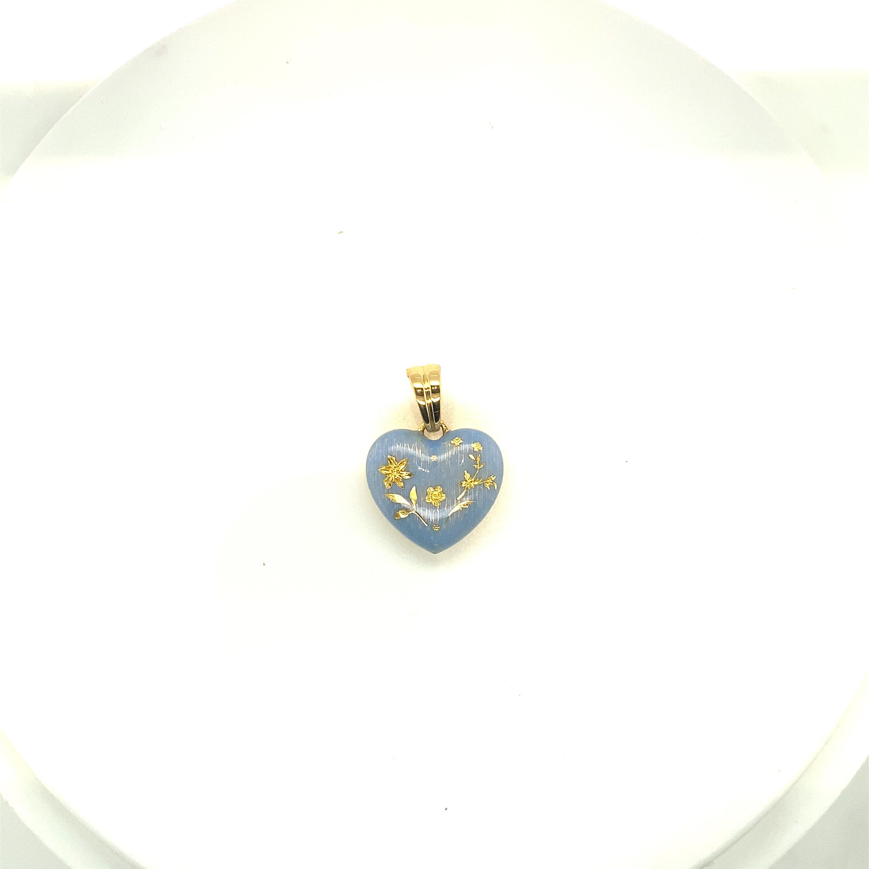 This modern 18 karat yellow gold Faberge heart pendant was made by Victor Mayer. The  perriwinkle blue enamel heart was  crafted in the same tradition of the original Imperial eggs using Faberges iconic guilloche enameling techniques. The heart