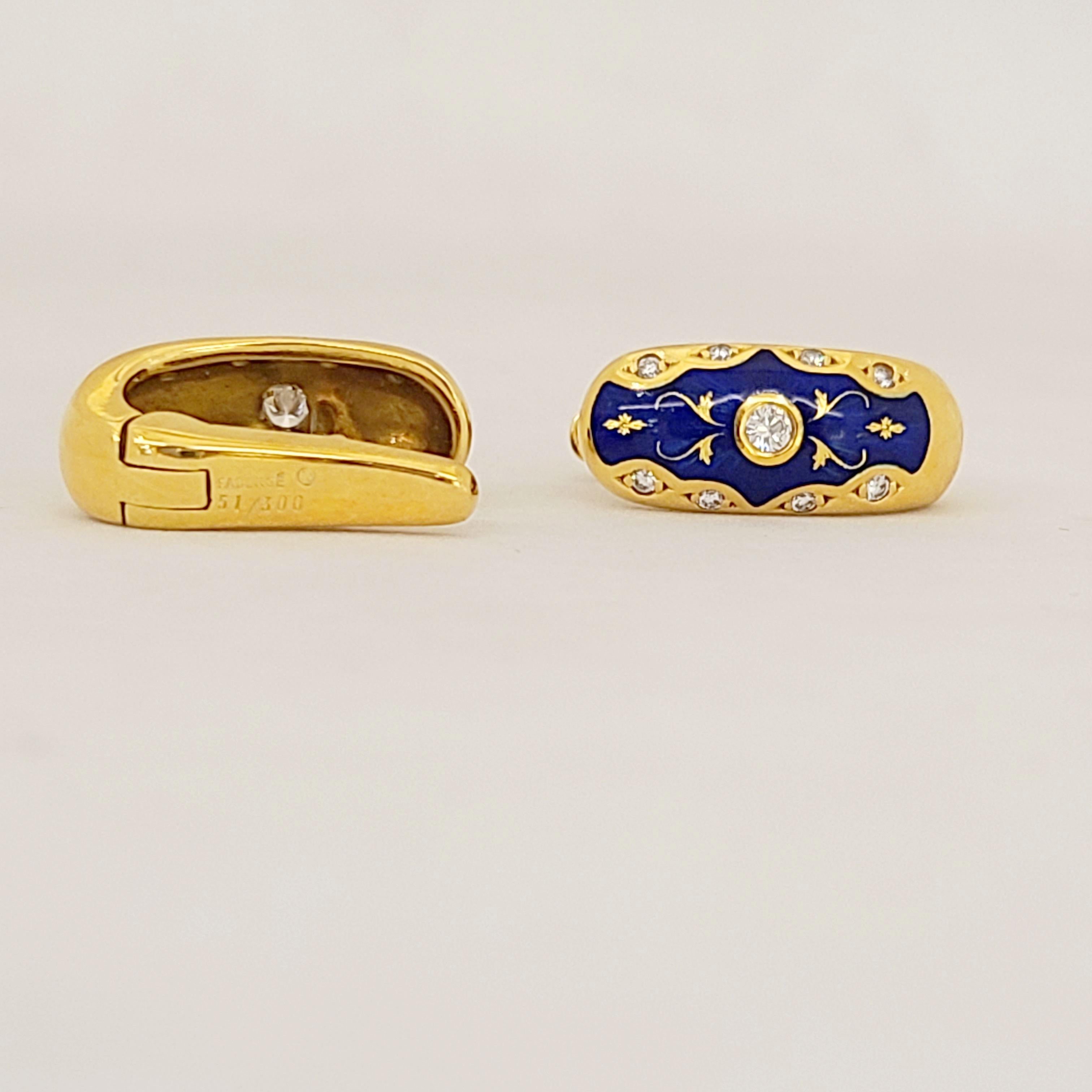 These modern Faberge 18 karat yellow gold huggy style pierced earrings center a bezel set round brilliant diamond. The earrings are crafted in a brilliant blue enamel, accented with diamonds and gold detailing.
The earrings were created by Victor