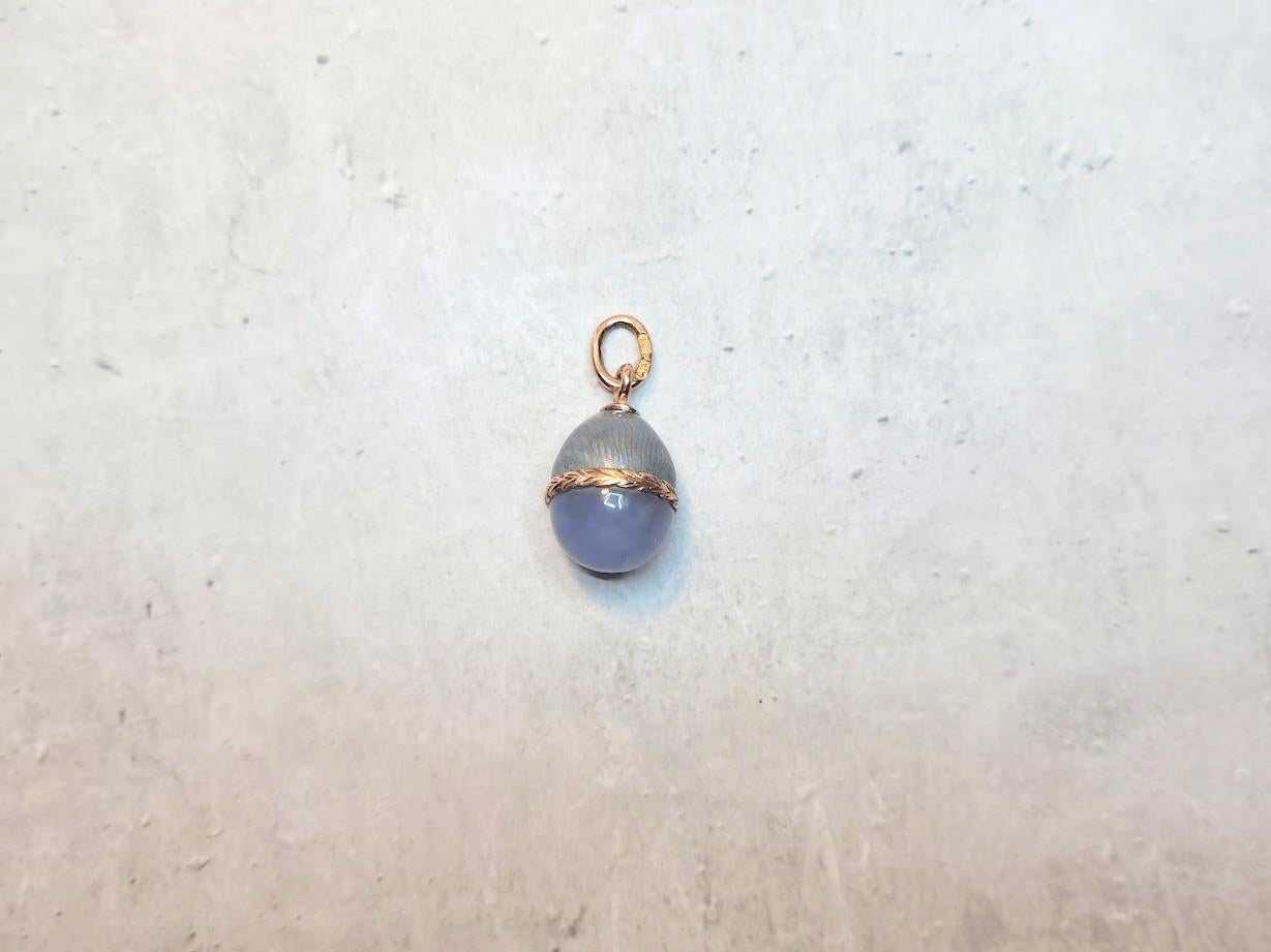 Antique Imperial Russian Guilloché Gold Egg Pendant, by Fabergé Workmaster Anders Nevalainen, circa 1900

Presenting an exquisitely beautiful and charming guilloché enamel gold egg pendant featuring lavender chalcedony. The upper section of the