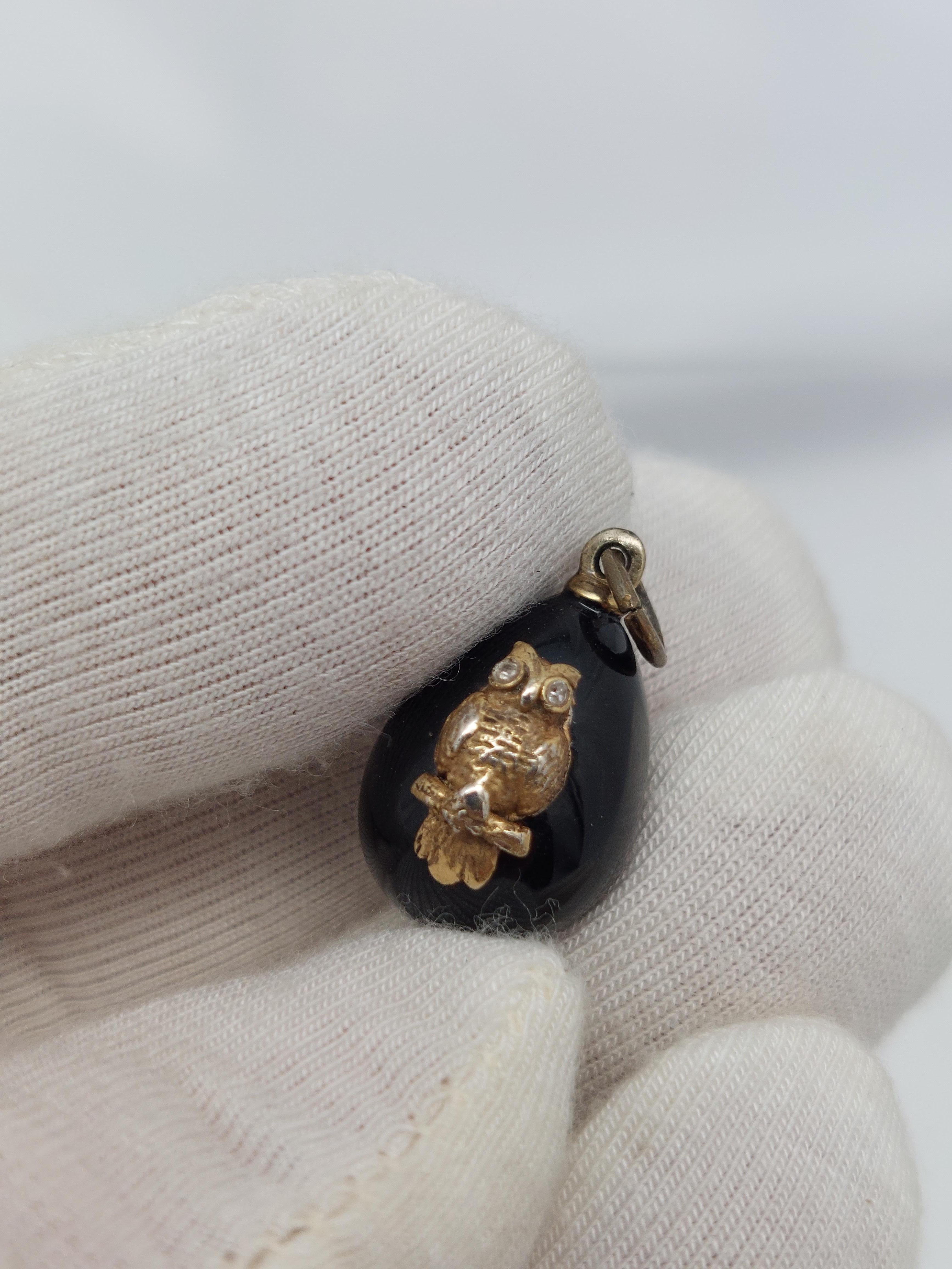 Treasured…
Faberge’  Silver Gilt Black Enamel Owl Pendant.
Owl has two diamond eyes measuring 1.20 m.m. each.
Pendant measures  1″ long, from bail to end of egg.
Egg measures  1/2 ” in diameter on the bottom.
Stamped on ring  ” 88   KQ (cryillic