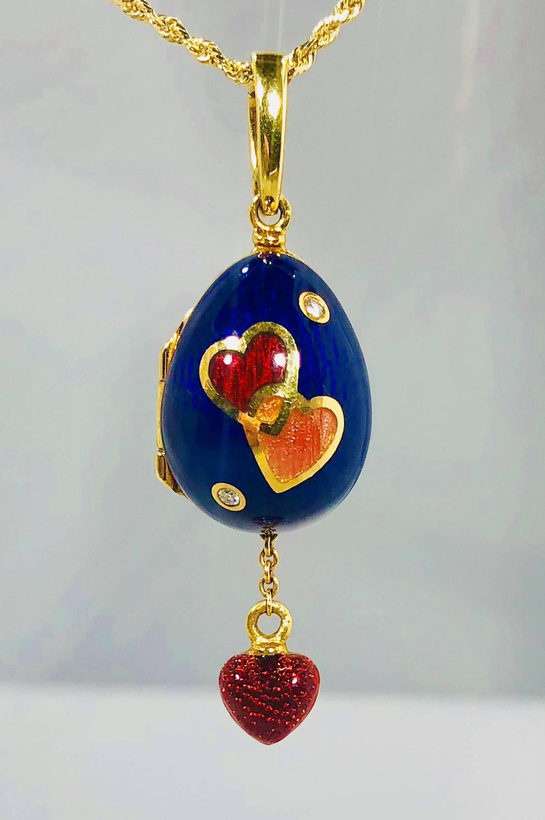 Faberge by Victor Mayer 18 karat and enamel diamond egg locket pendant. This piece is created in 18 karat yellow gold and weighs 13.7 grams/ 8.7 dwt. There are two round cut diamonds equaling .03 carats total weight, Color E-F Clarity VVS2. This