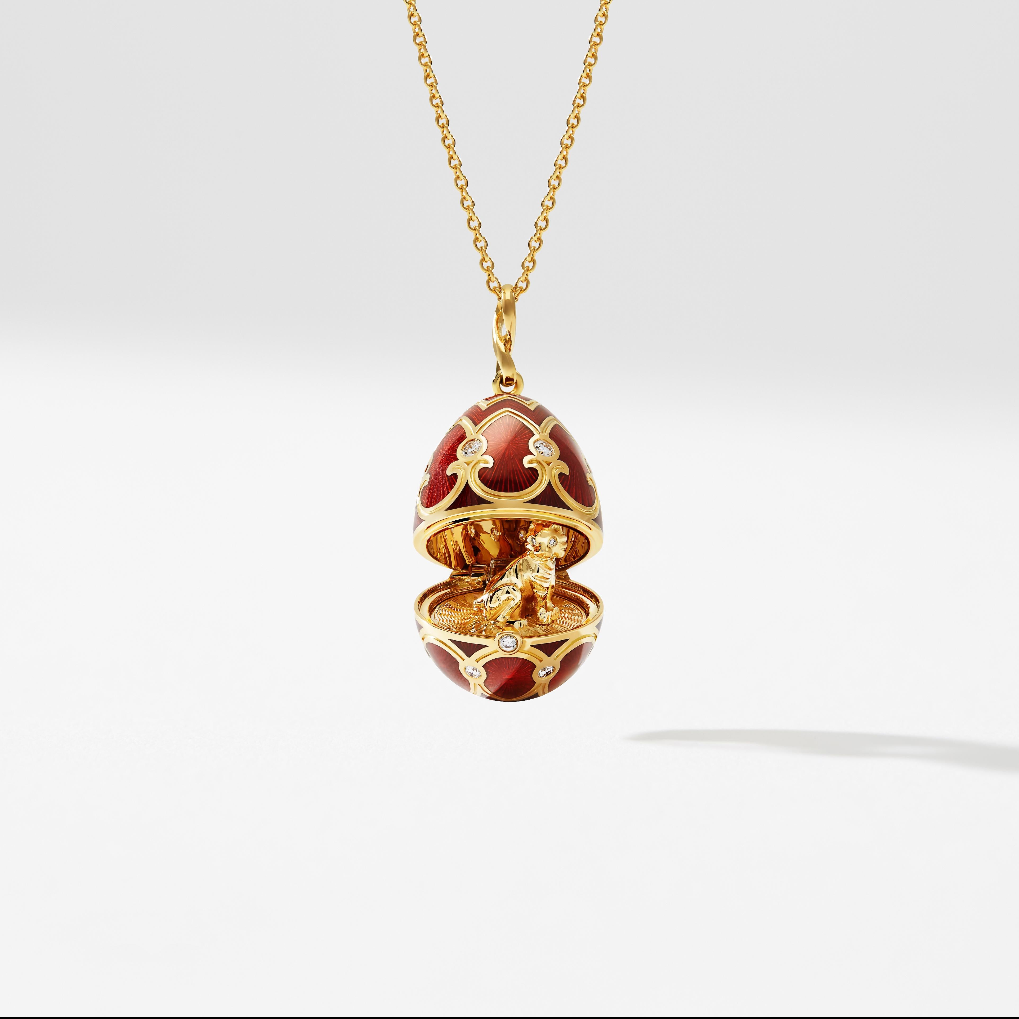 The Heritage Yellow Gold Diamond & Red Guilloché Enamel Year Of The Tiger Surprise Locket features red guilloché enamel and round white diamonds, set in 18 karat yellow gold. The locket opens to reveal an 18 karat yellow gold tiger with diamond set